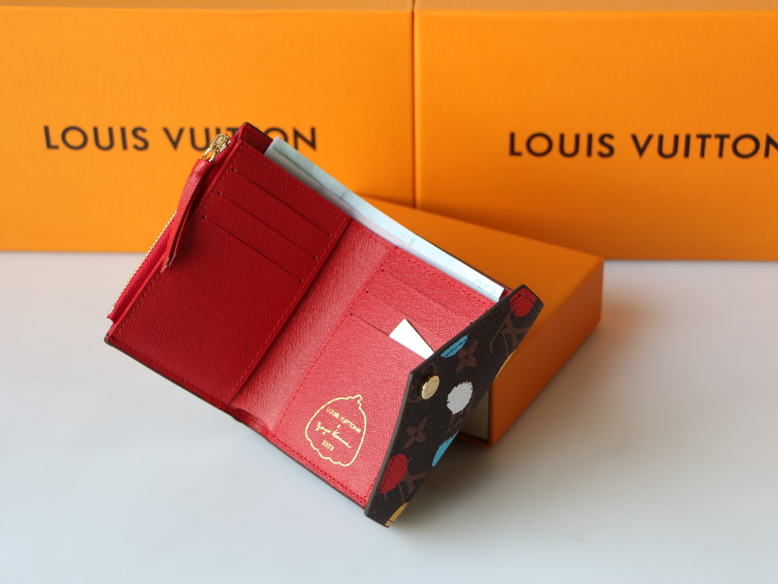 YK Victorine Wallet being held, showing size and functionality