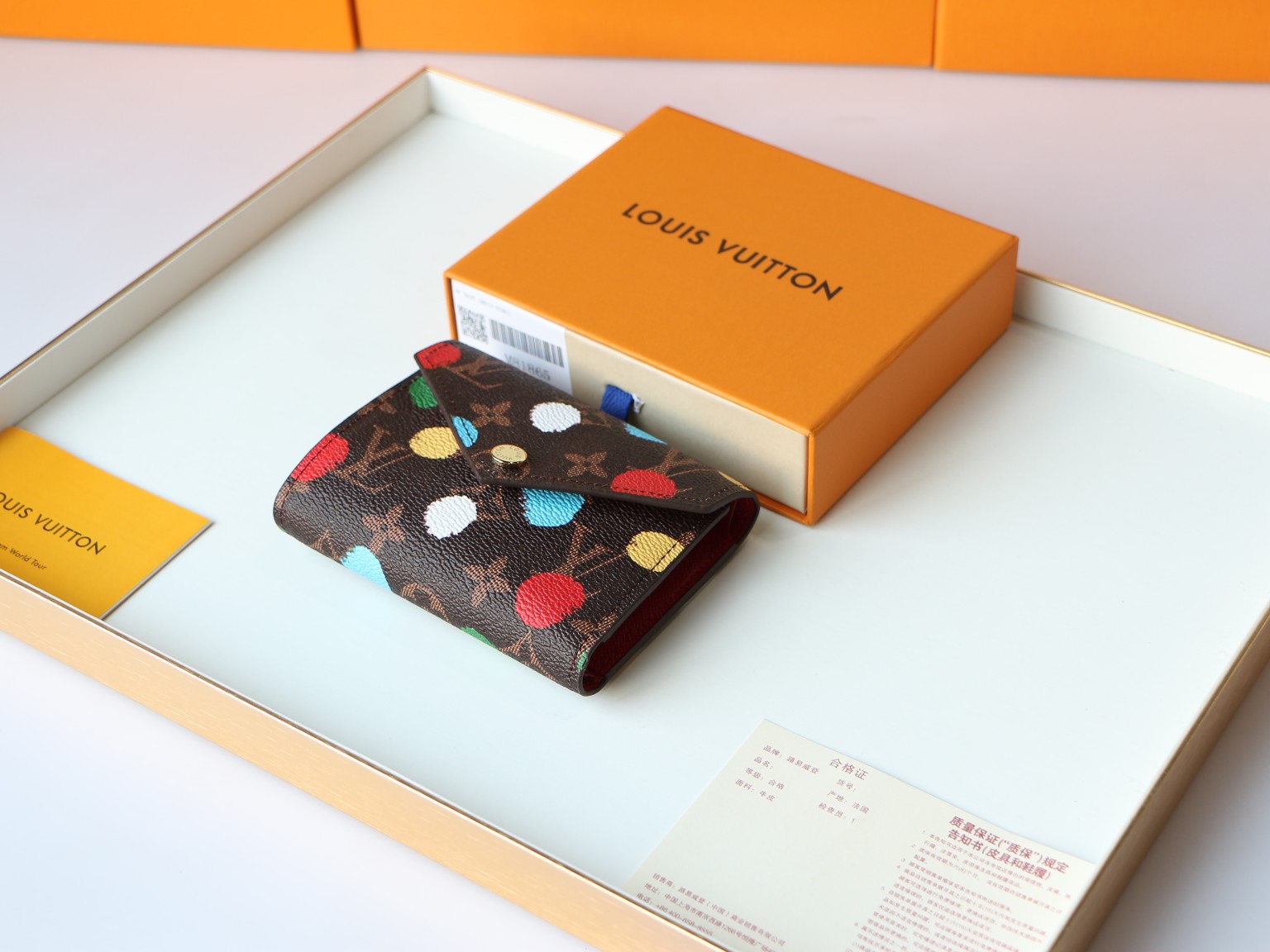 The YK Victorine Wallet on a flat surface