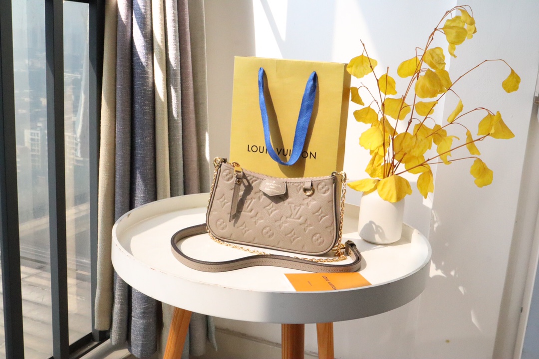 Louis Vuitton LV Easy Pouch On Strap Shop
 Handbags Clutches & Pouch Bags Empreinte​ Spring Collection Chains M80349