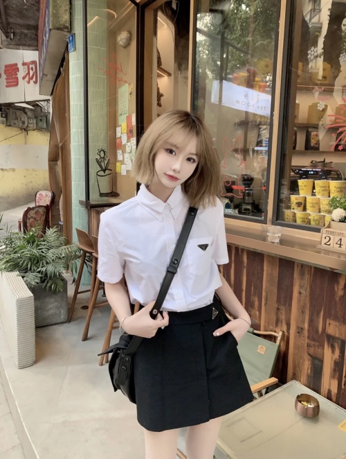 Prada Pleated Mini Skirt with Triangle Logo - High-End, Comfortable 1 Prada Pleated Mini Skirt with Triangle Logo - High-End, Comfortable