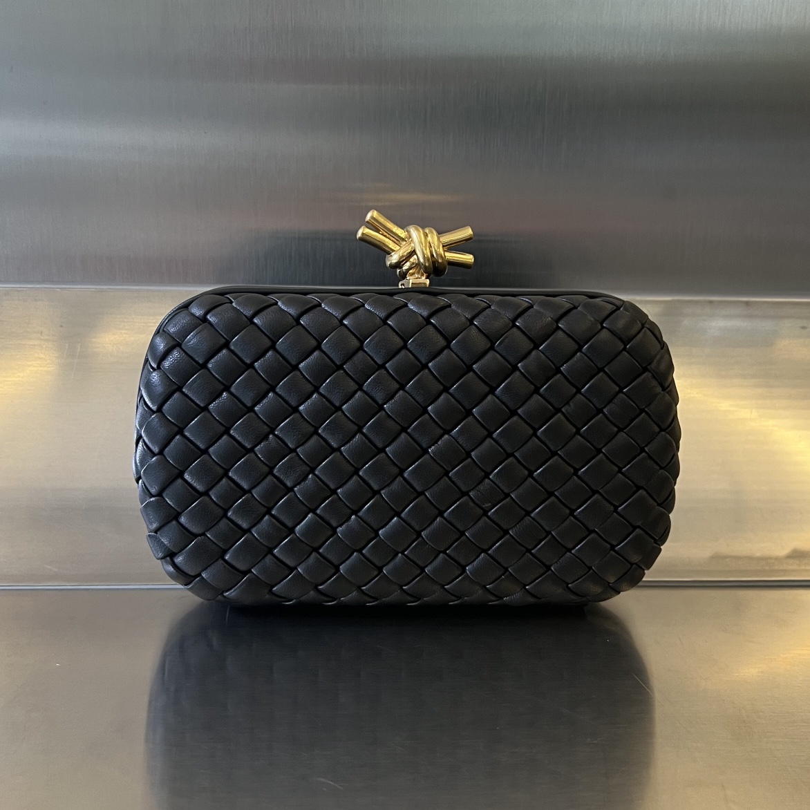 Bottega Veneta Knot evening clutch bag, lambskin, woven texture, metal knot clasp