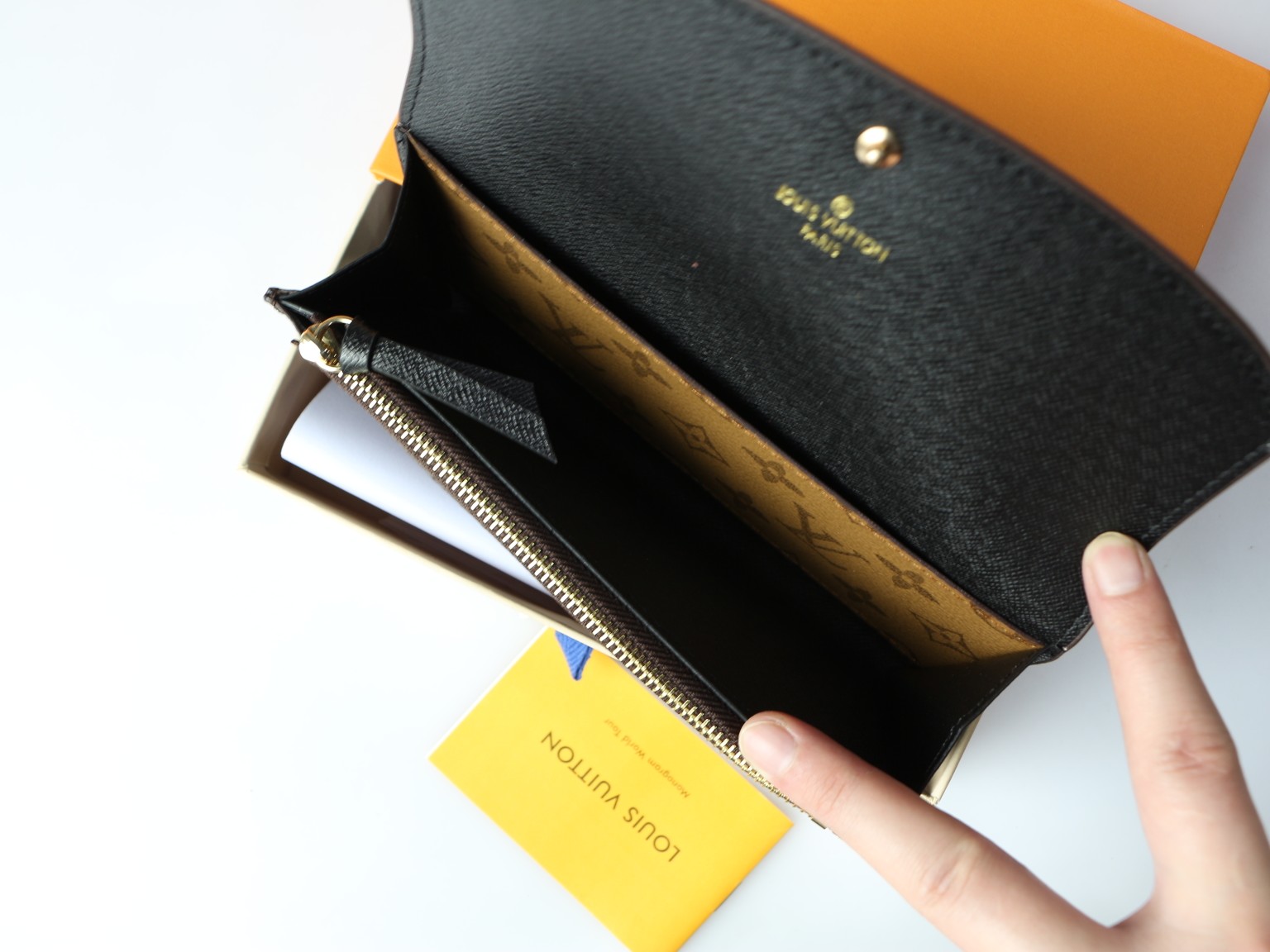 Leather wallet in a woman's hand