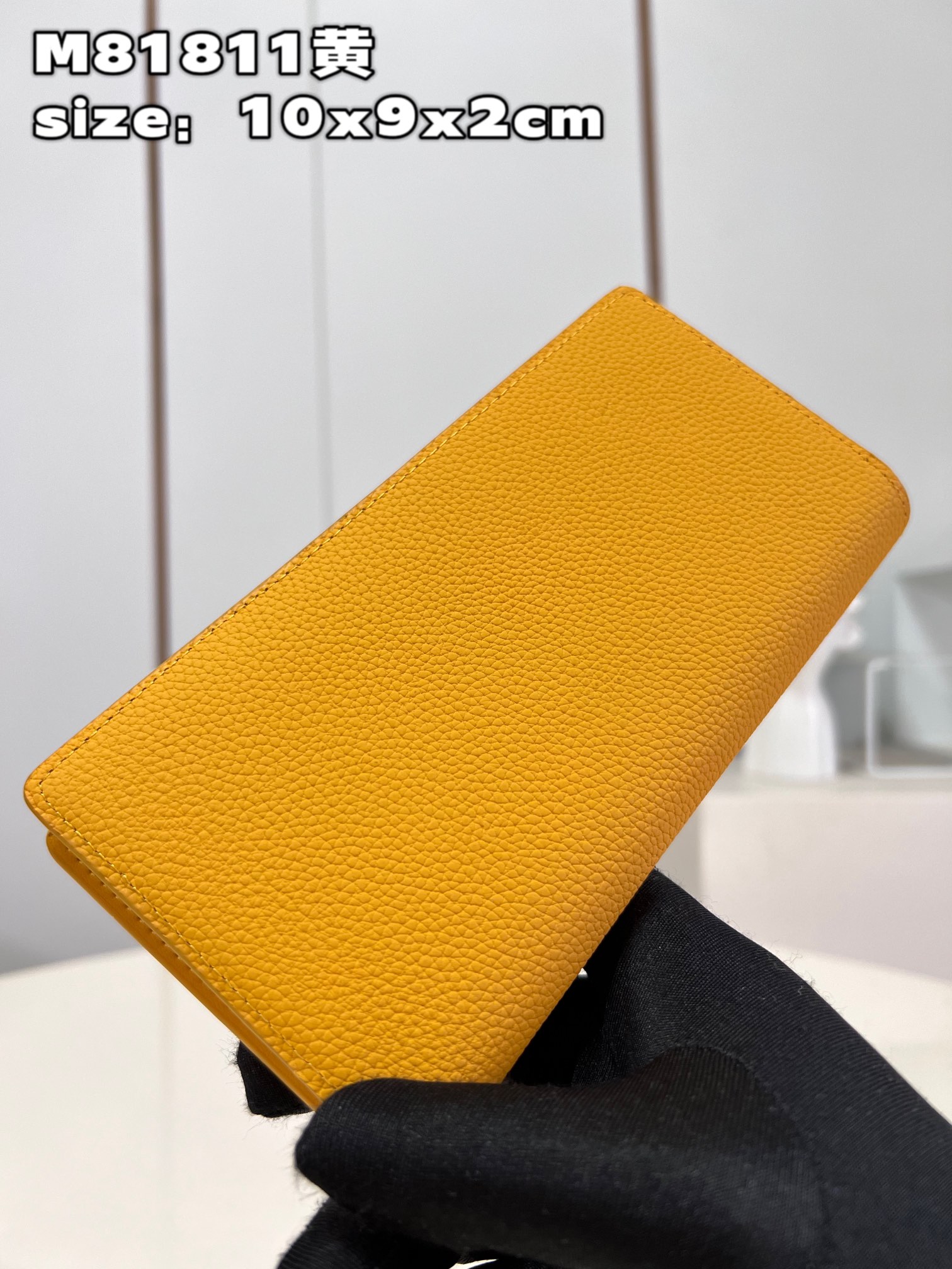 This classic Louis Vuitton Brazza Wallet takes on a distinctive new look - Bag 4