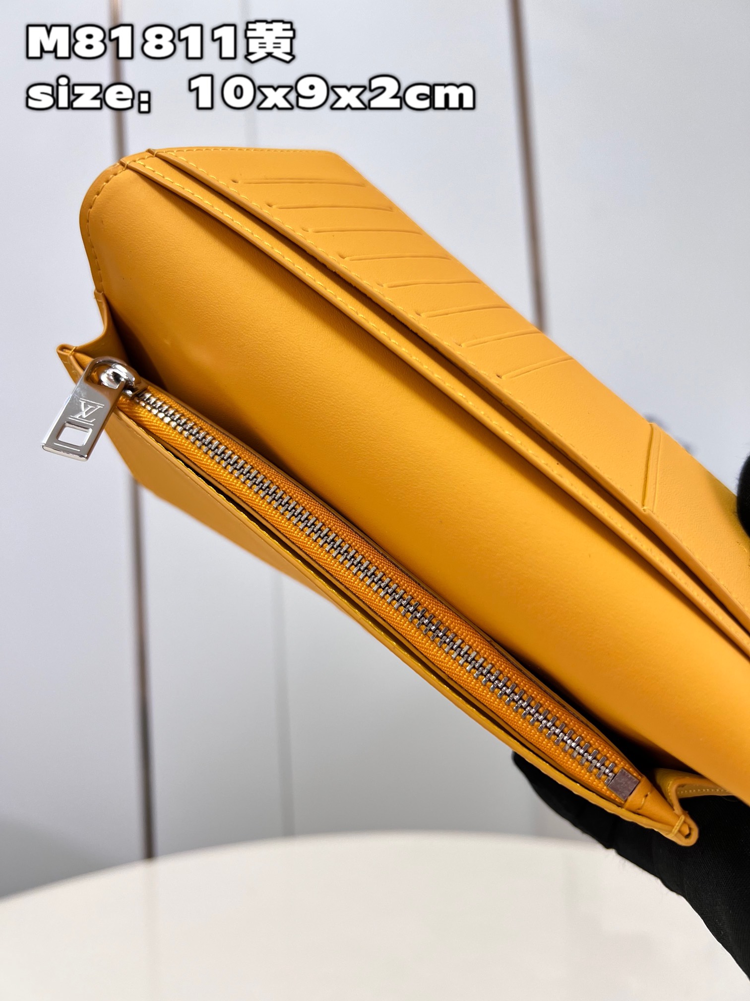 This classic Louis Vuitton Brazza Wallet takes on a distinctive new look - Bag 8