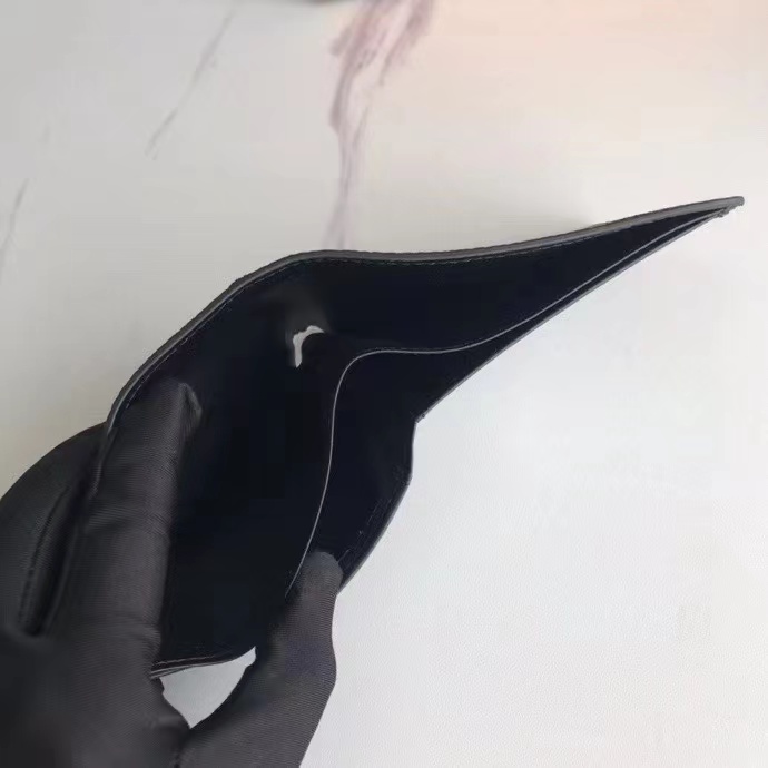 Hand holding RFID blocking leather wallet