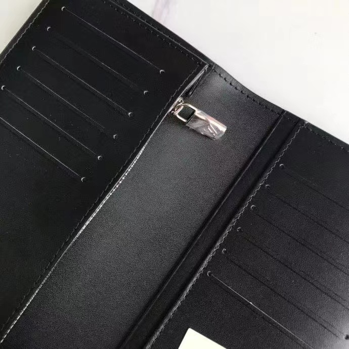 Leather bifold wallet showing leather aging over time