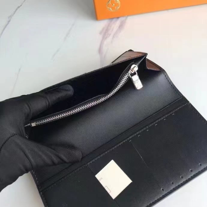Leather bifold wallet with card in it