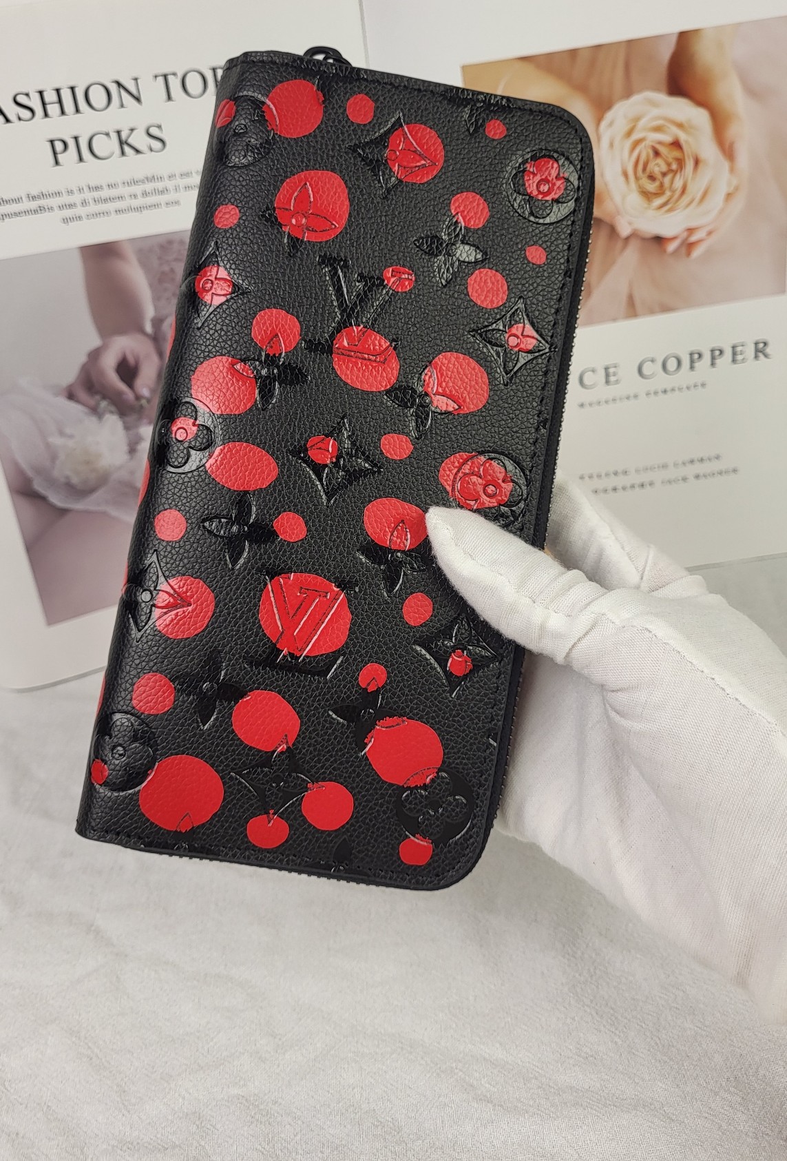 The leather wallet open with cards and cash