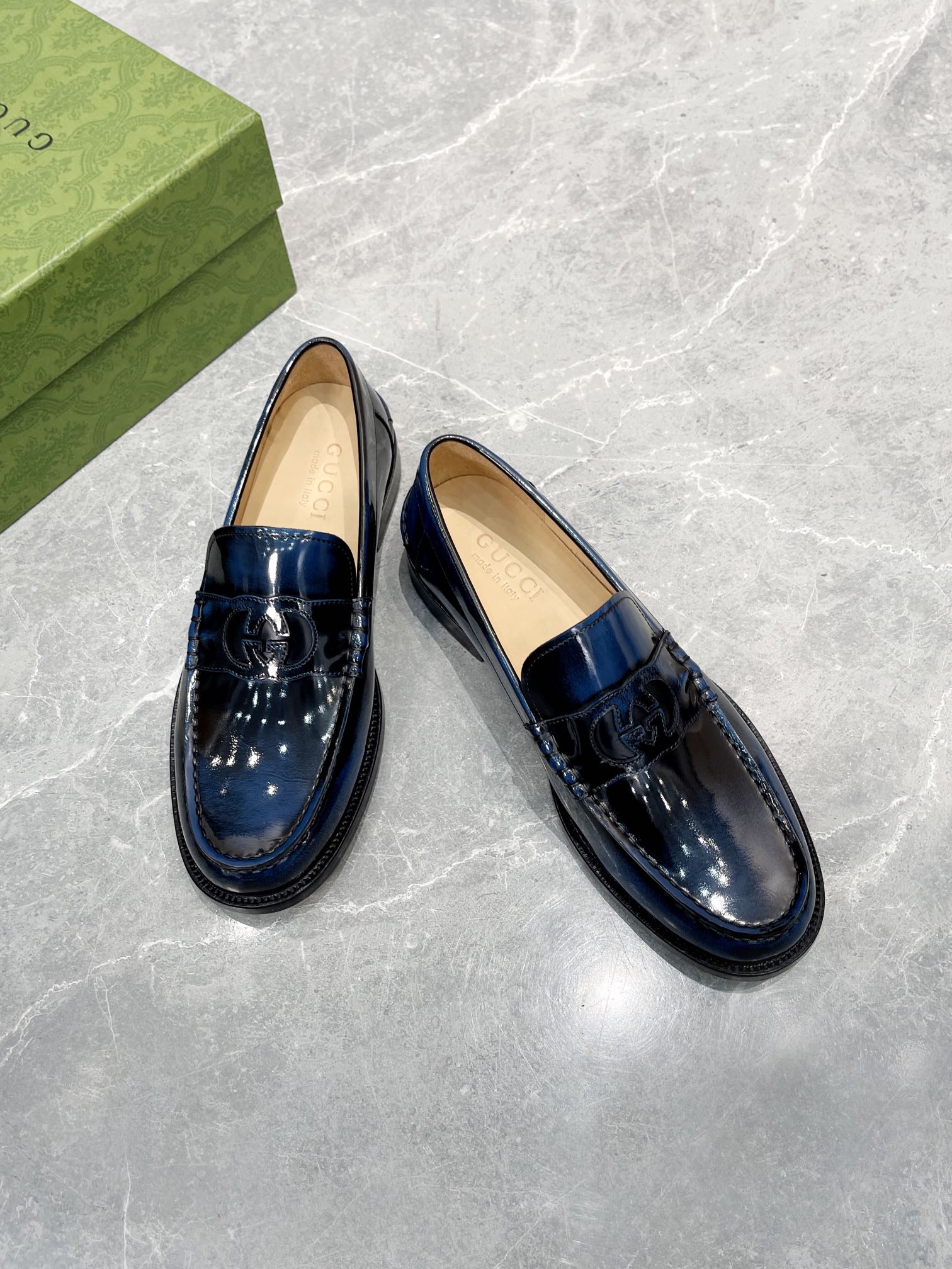 Gemstones give this loafer made of black leather a sophisticated vintage cut an