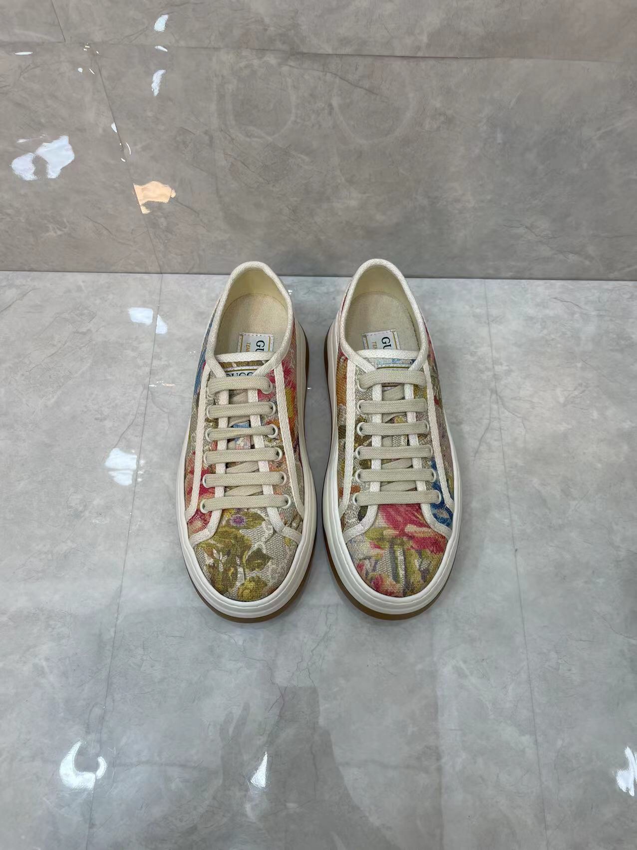 NO:171020,New Women's GG Sneakers This Season's hit with striking silhouettes draw inspiration from tennis courts. Made of tonal beige and ebony Original GG canvas, the thick sole and contrasting fabric trim create a modern aesthetic. Original GG canvas Women's Fabric Trim Rubber Sole with Double G Lace-up Closed Flat 2