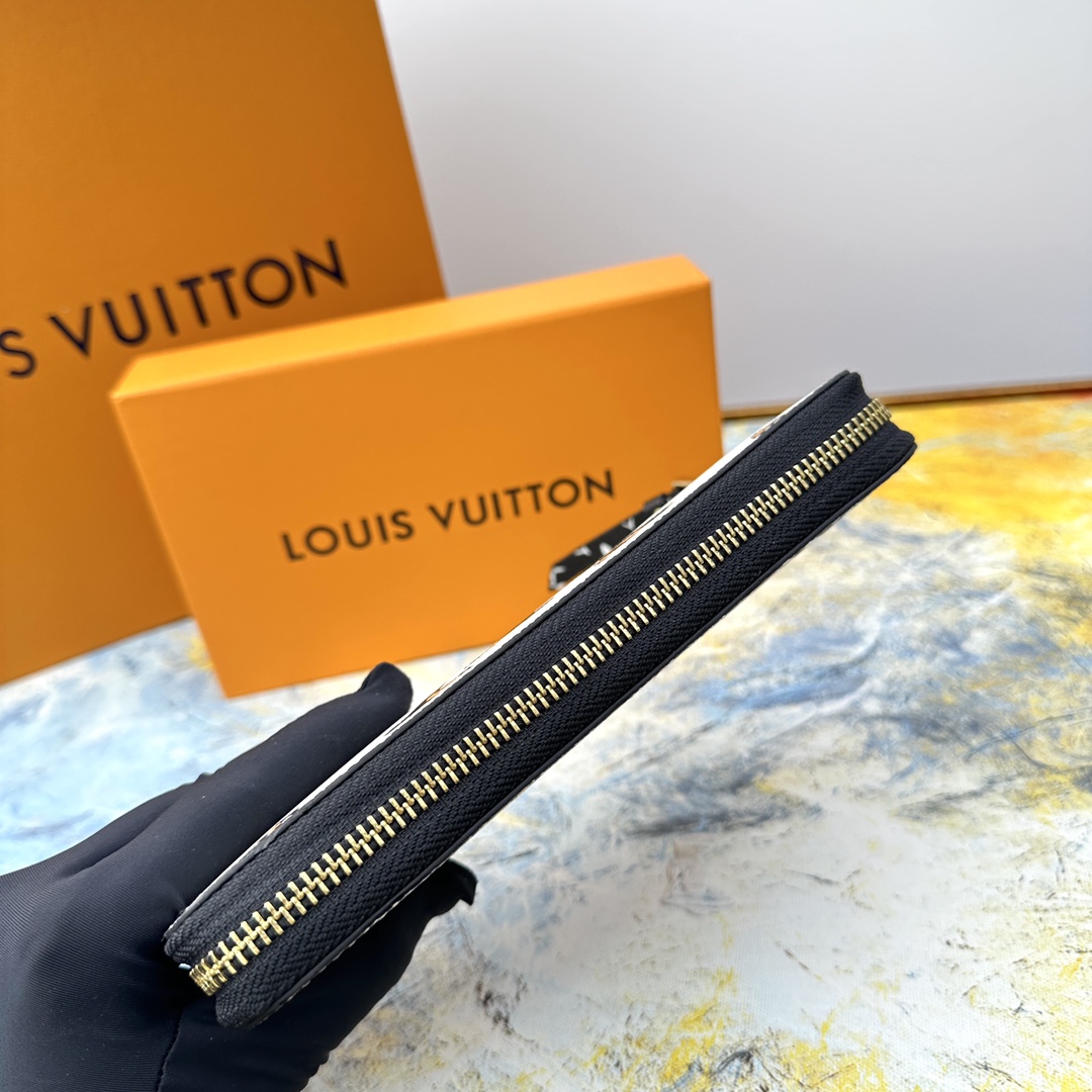 Zip around wallet open with cards, cash, and coins.