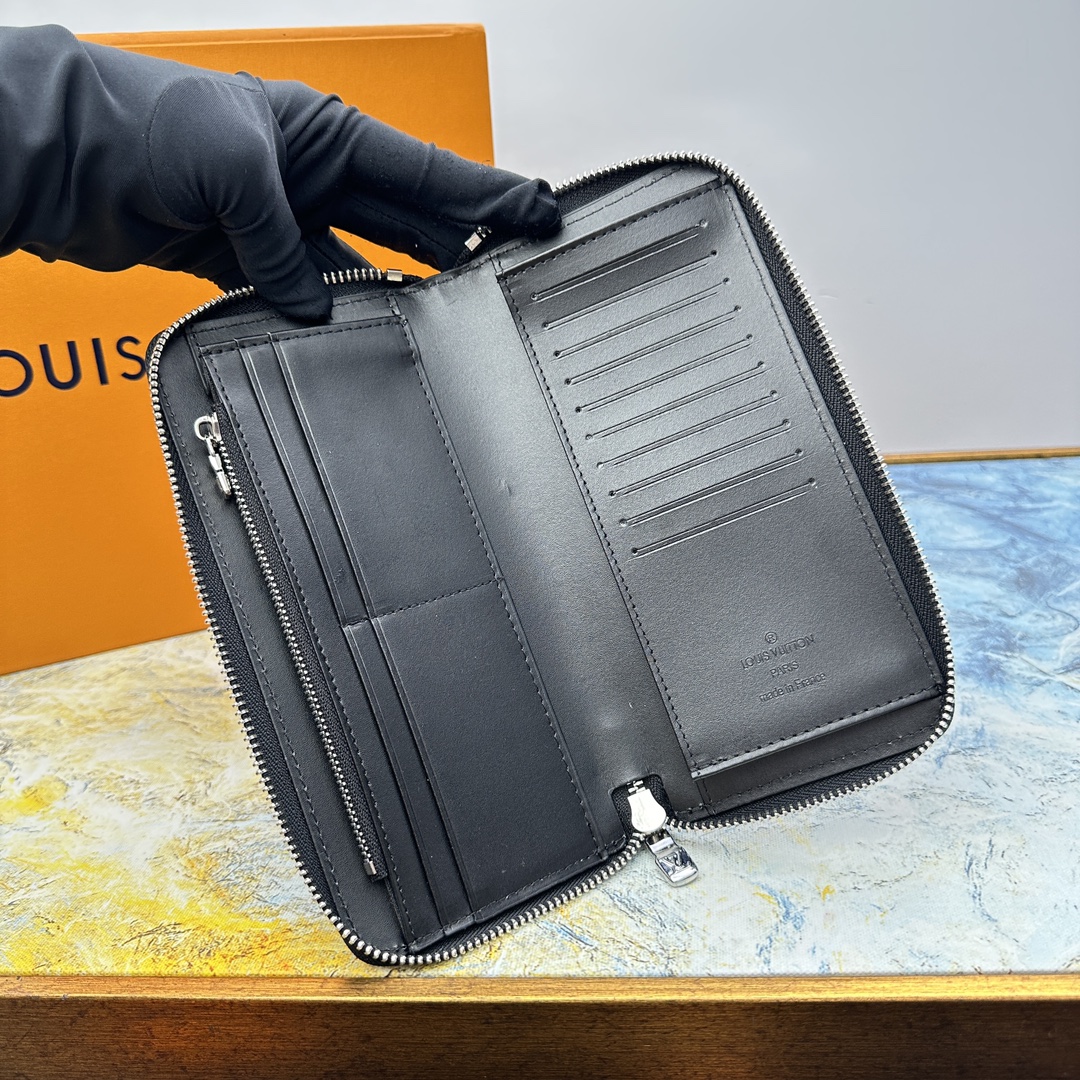 Black leather wallet with cash and cards