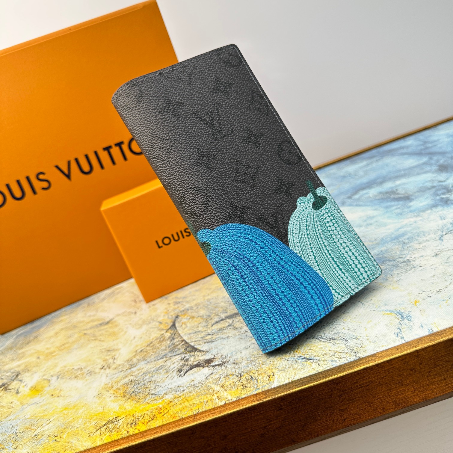Open view of a leather bifold wallet, showing card slots and bill compartment.