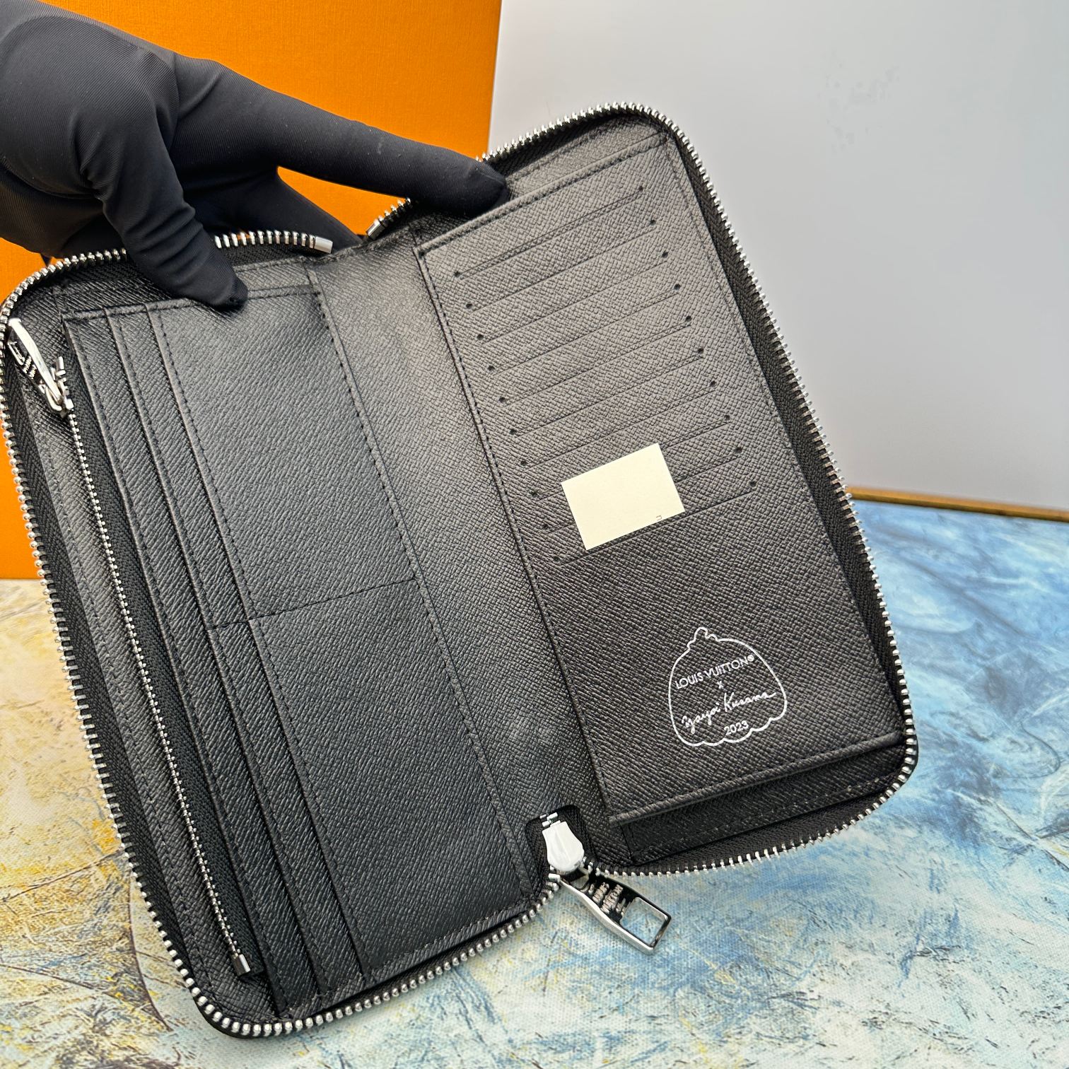 Leather zip around wallet zipper detail