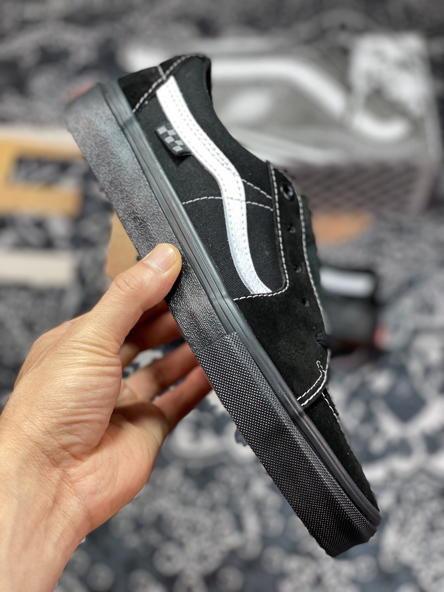 Vans Sk8-Low Black Warrior all-black body with white trim on the side casual skateboard shoes