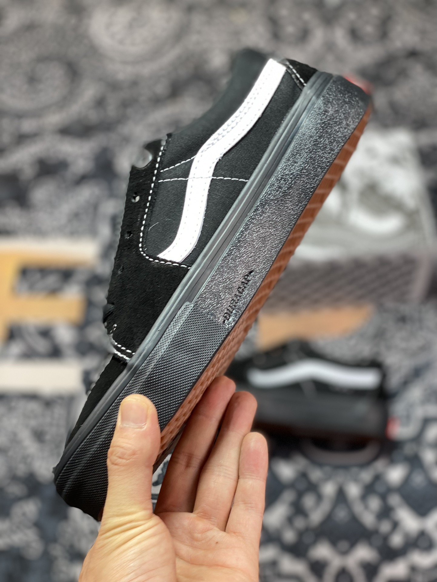 Vans Sk8-Low Black Warrior all-black body with white trim on the side casual skateboard shoes