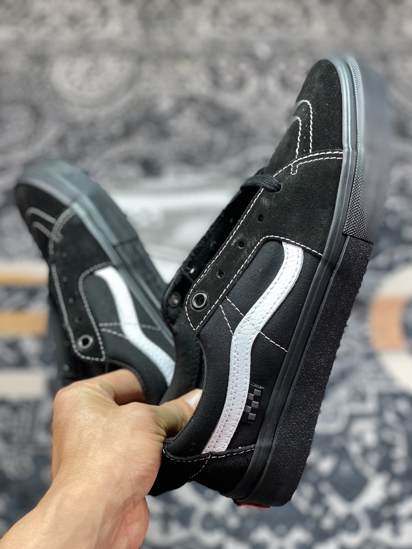 Vans Sk8-Low Black Warrior all-black body with white trim on the side casual skateboard shoes