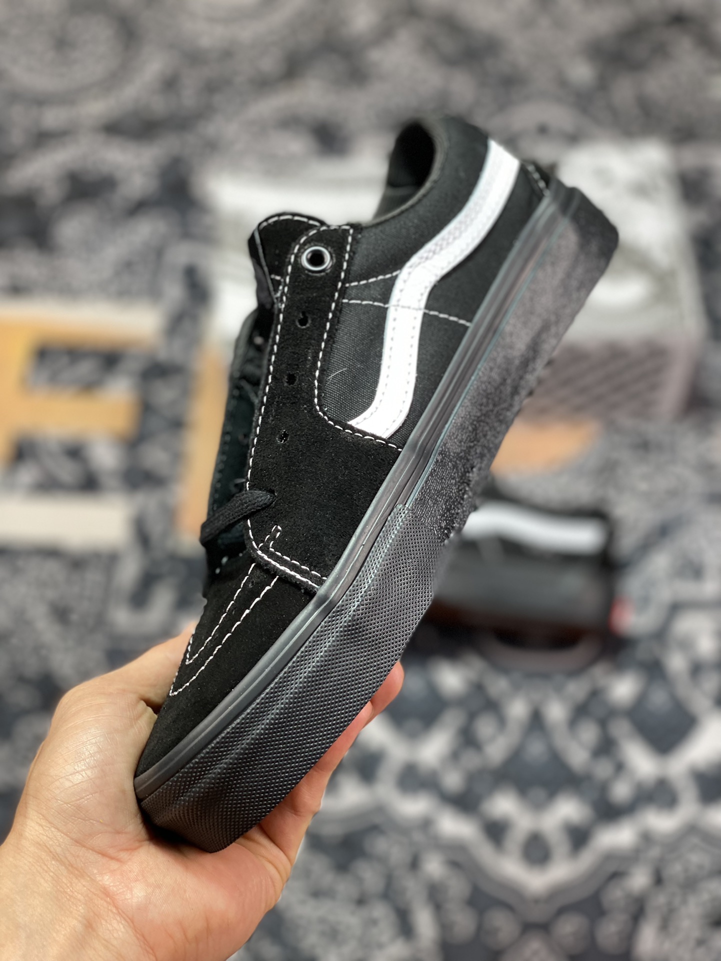 Vans Sk8-Low Black Warrior all-black body with white trim on the side casual skateboard shoes