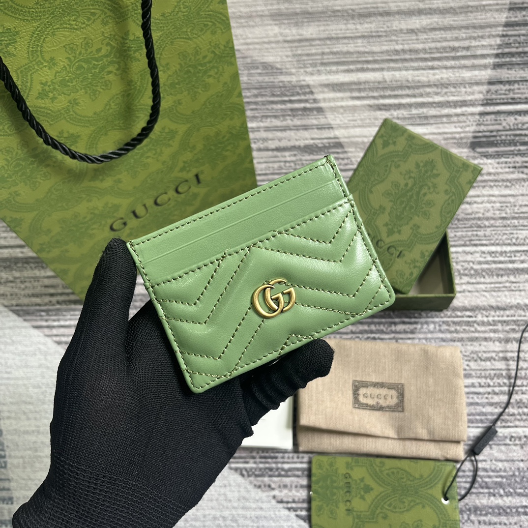 Green quilted V-shaped leather card holder with Double G hardware