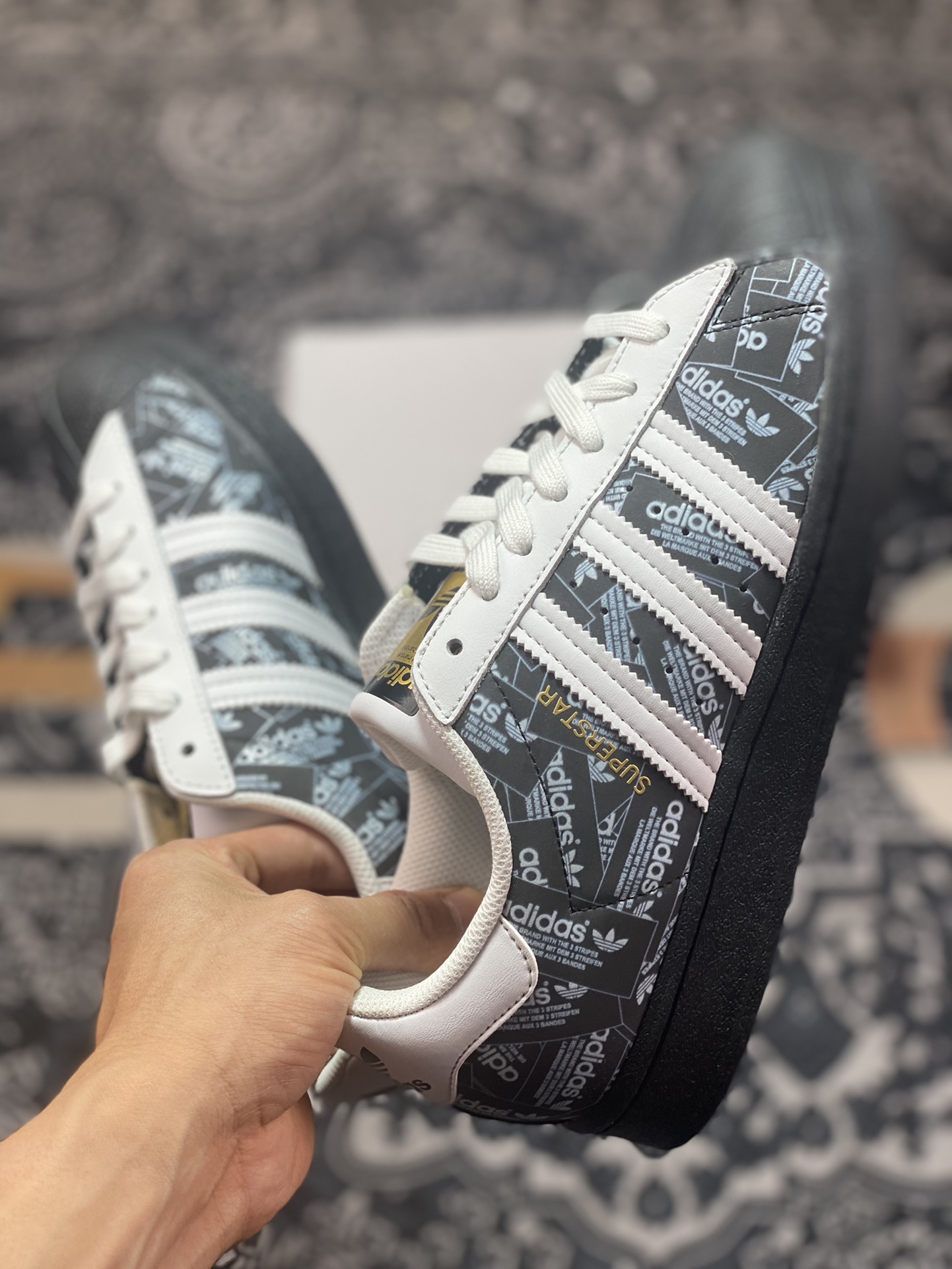 Originals Superstars All Over Print ”Reflective Labels” shell toe sneakers ”black and white gold text reflective brand label” FV2820