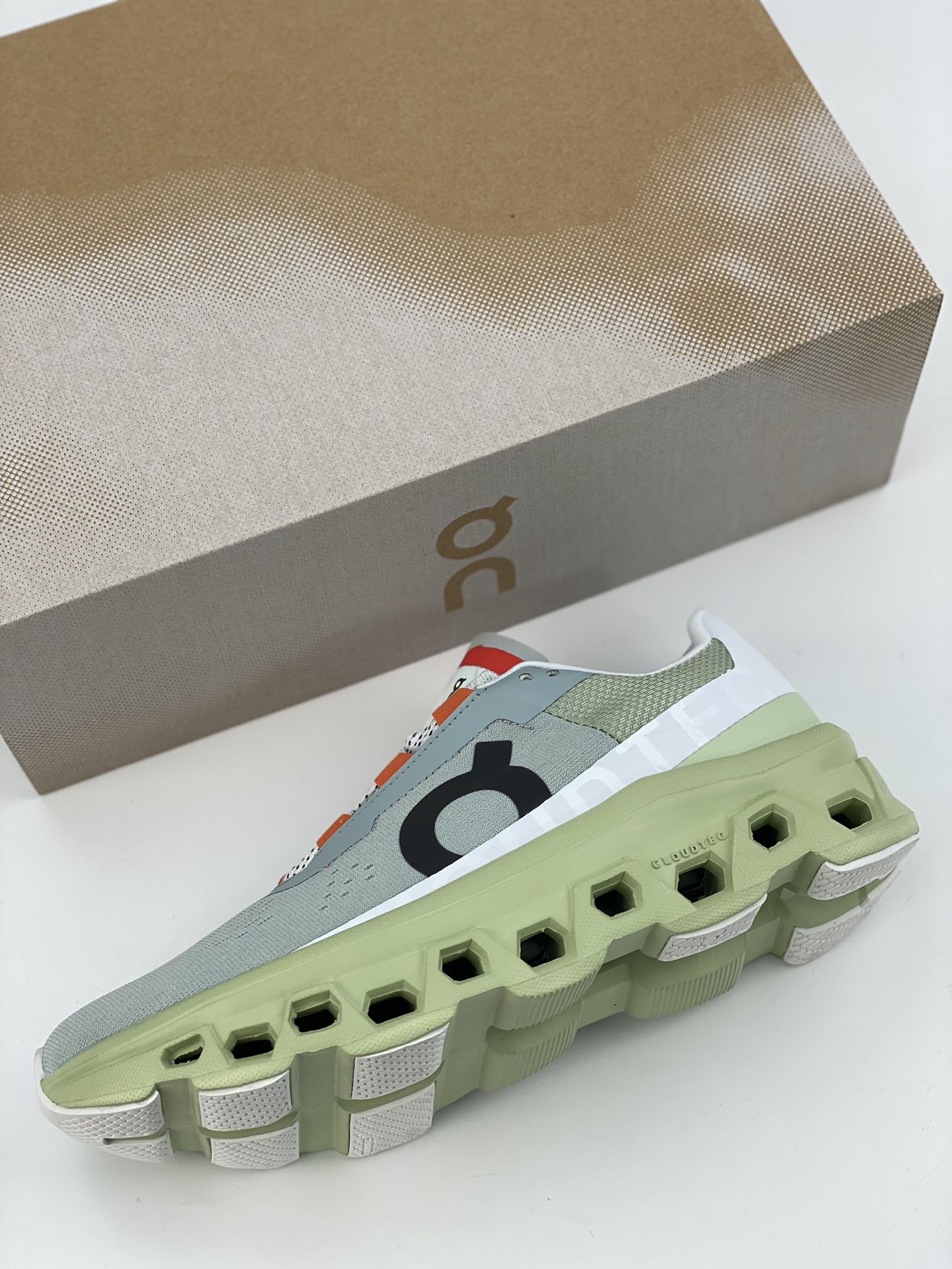 On Cloudmonster Glacier Grey Green is a tennis-inspired sports casual shoe.