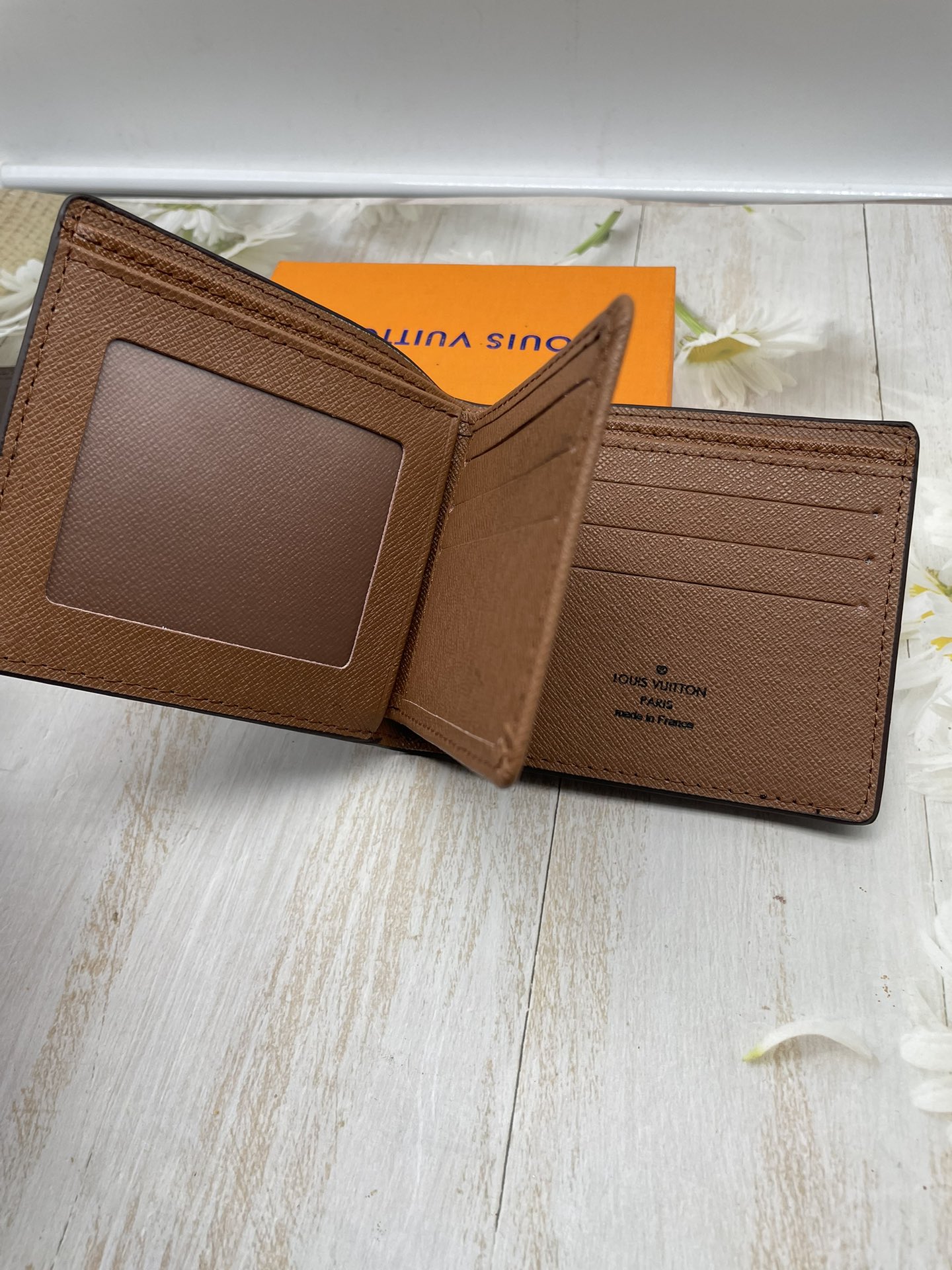 Leather wallet slim profile held in hand