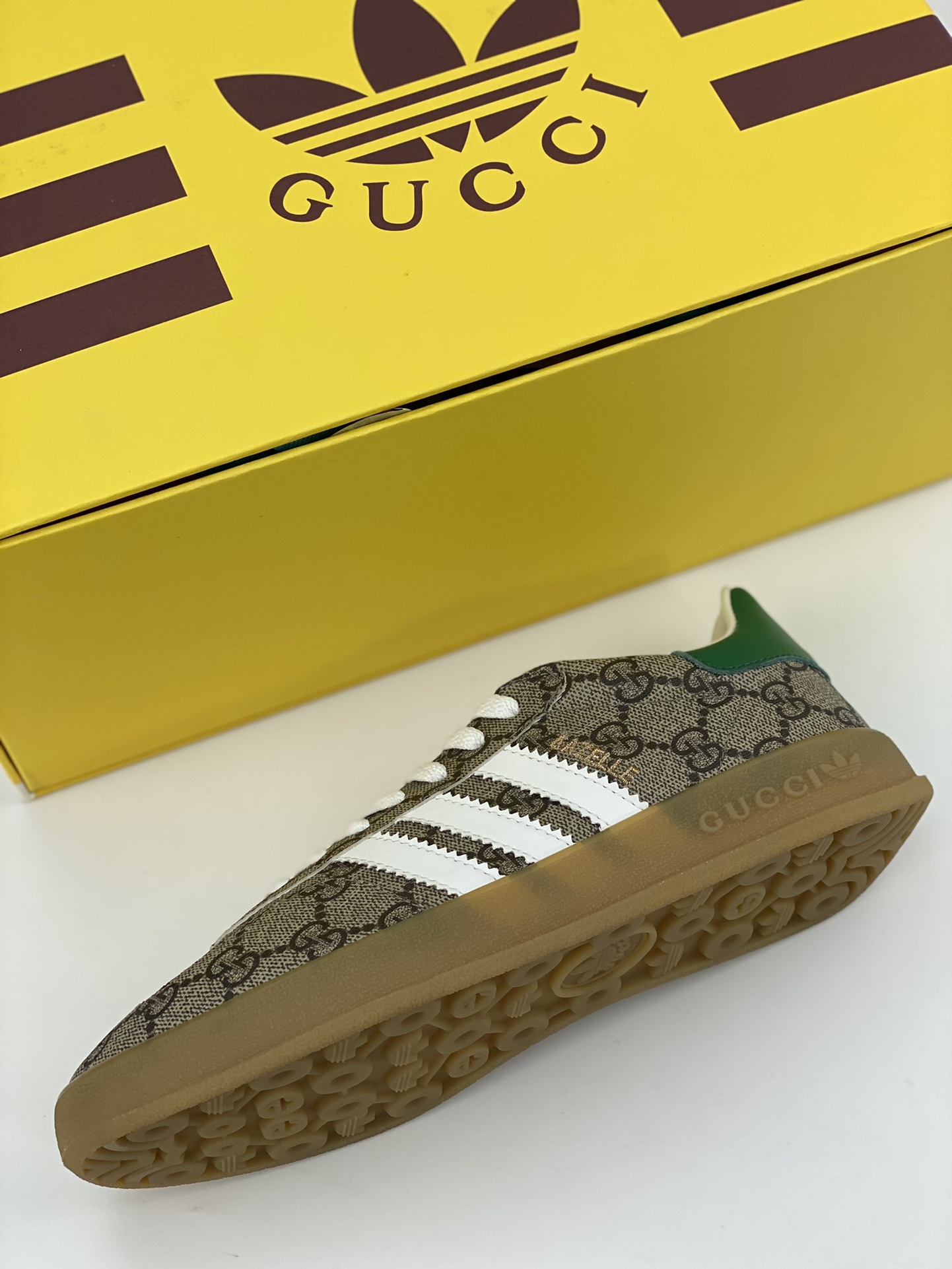 Adidas x GUCCI's blockbuster co-branded clover logo and iconic three bars are design elements