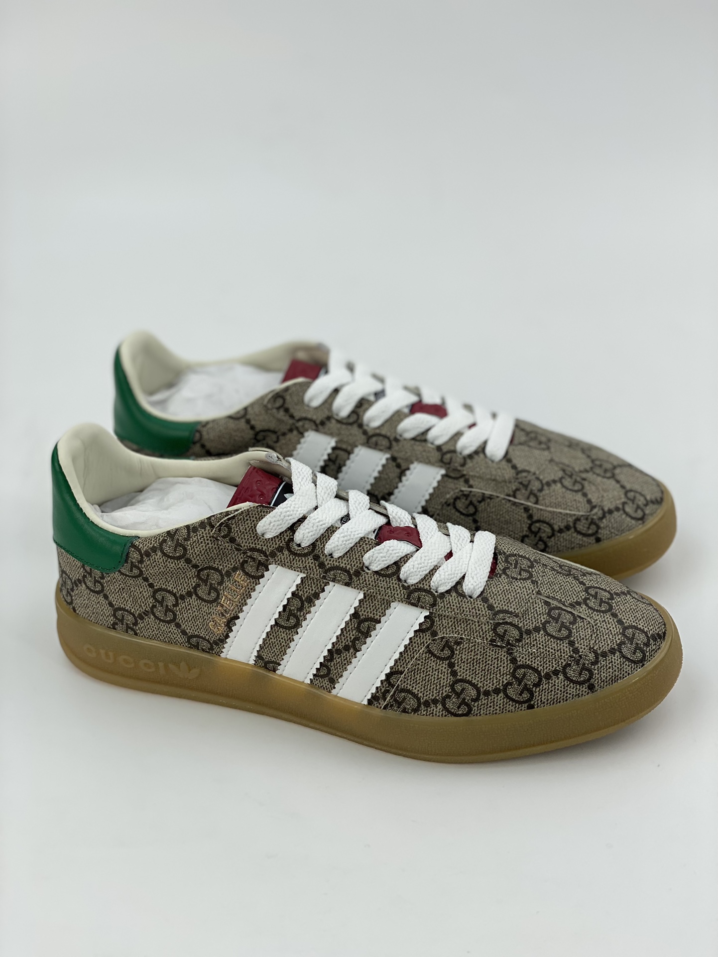 Adidas x GUCCI's blockbuster co-branded clover logo and iconic three bars are design elements