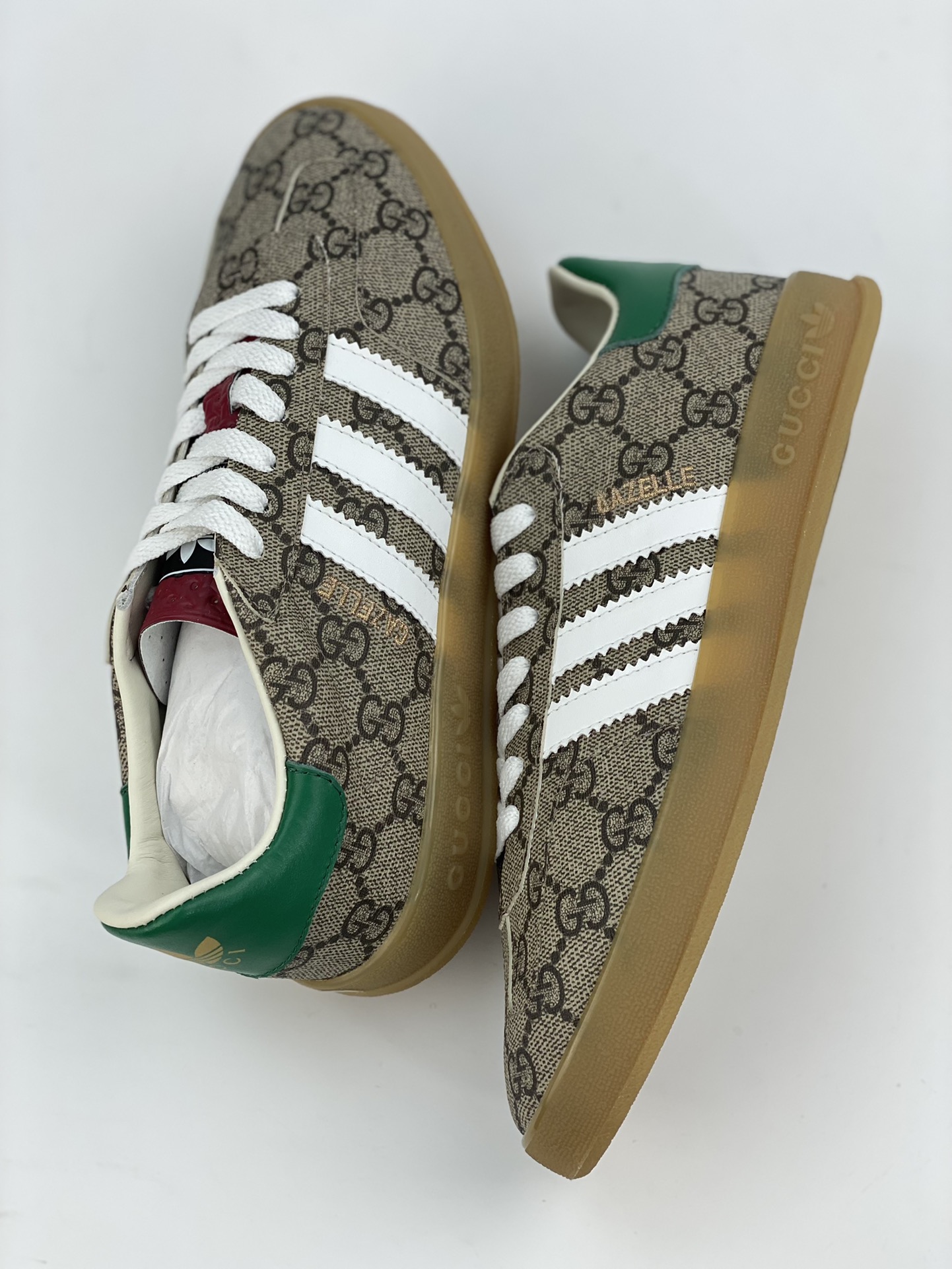 Adidas x GUCCI's blockbuster co-branded clover logo and iconic three bars are design elements