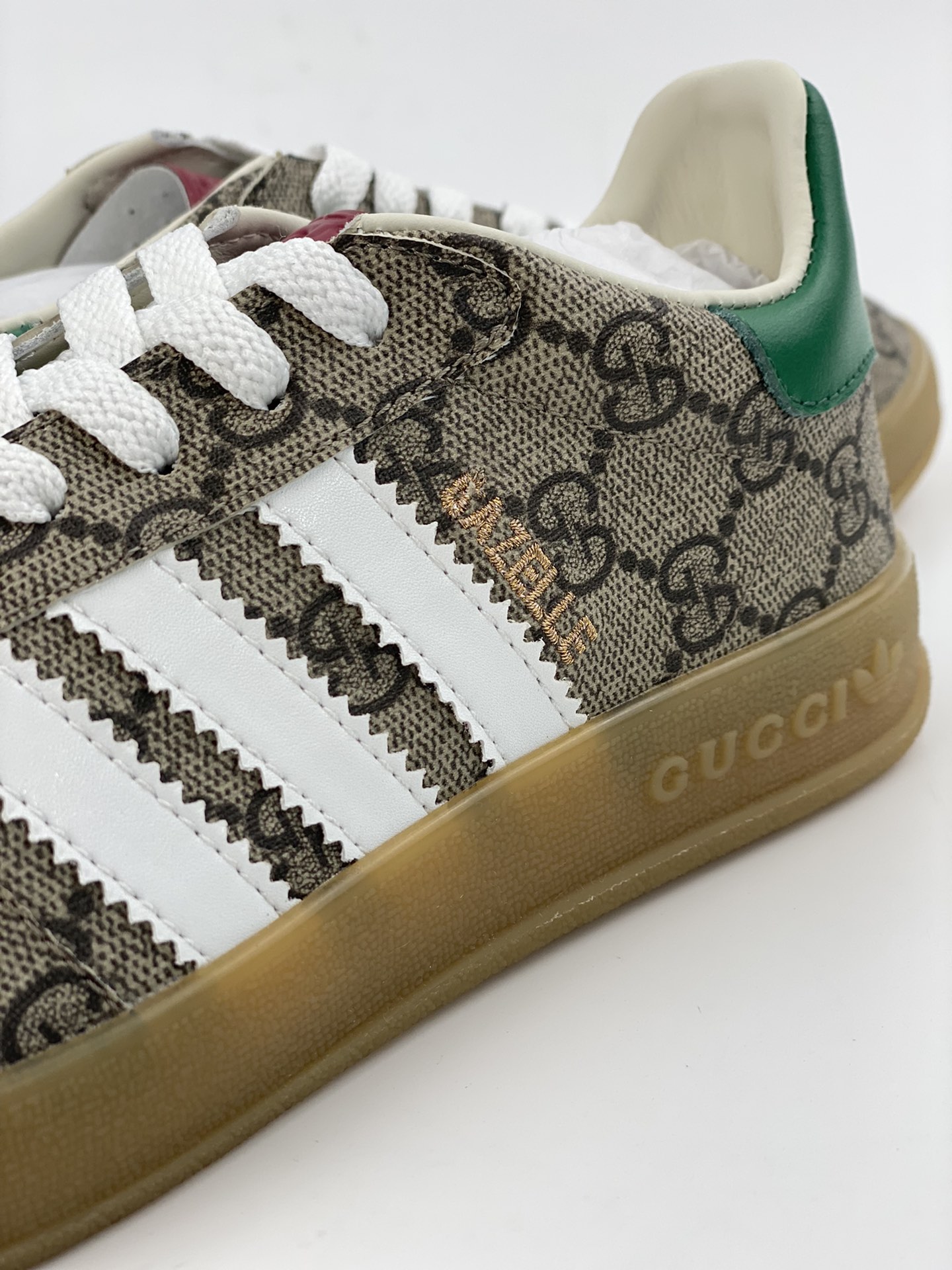 Adidas x GUCCI's blockbuster co-branded clover logo and iconic three bars are design elements