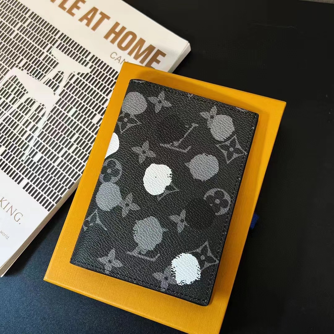 Passport cover being held in the hand