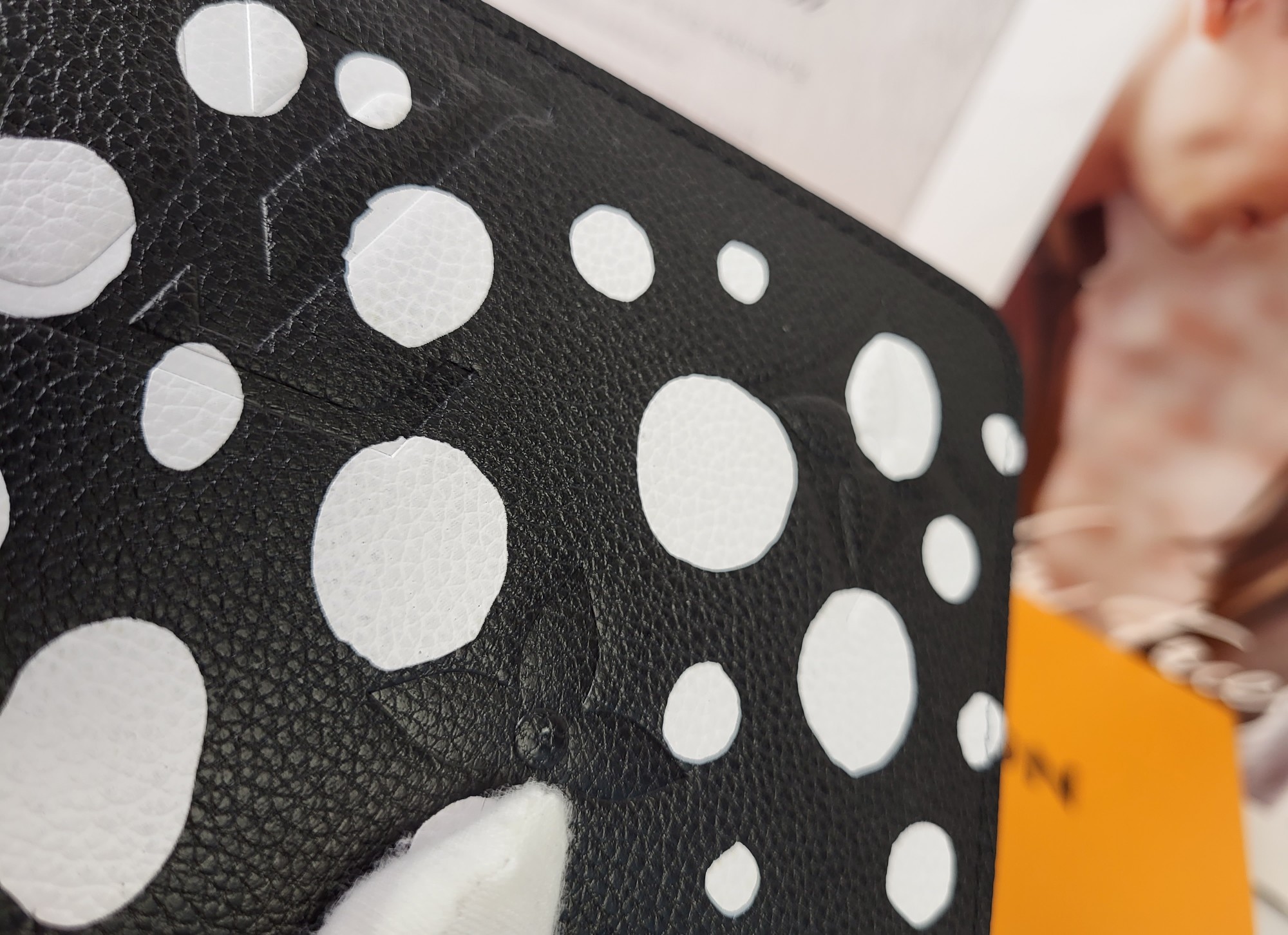 Long leather wallet in hand