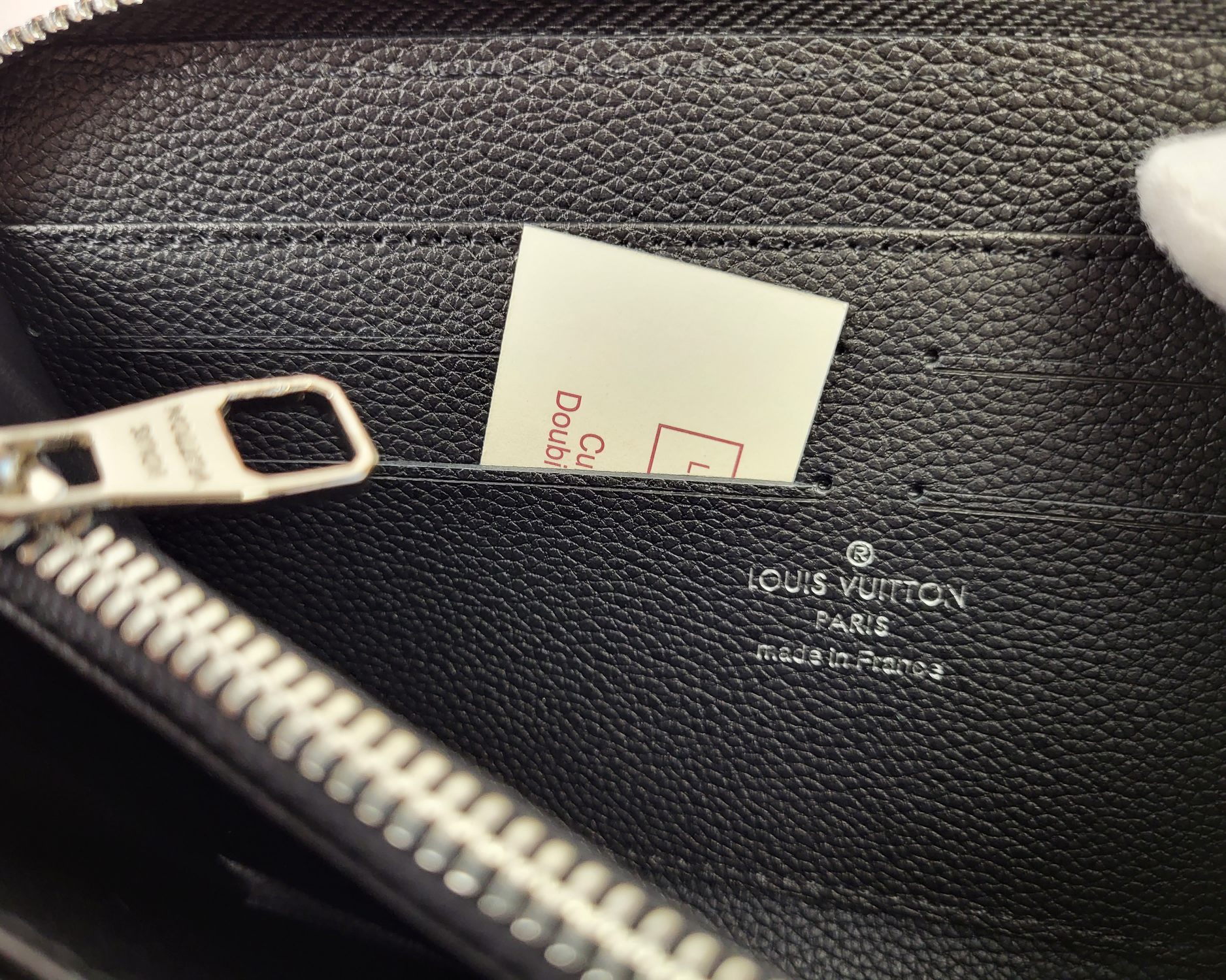 Lifestyle shot of leather wallet being used