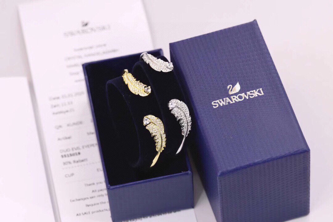 swarovski金色银色羽毛开口手镯羽毛是现时最受欢迎的设计元素华丽考究的造型缀有闪亮迷人的密swar