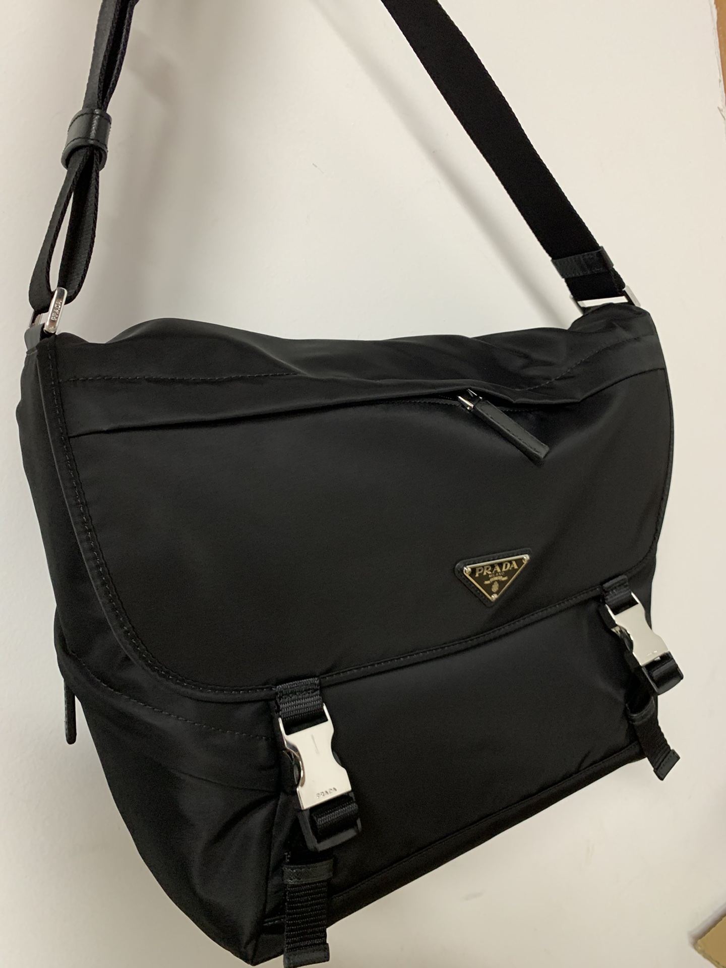 PRADA's latest messenger bag, made of original parachute waterproof fabric inside and out, silver brushed hardware, long adjustable nylon shoulde