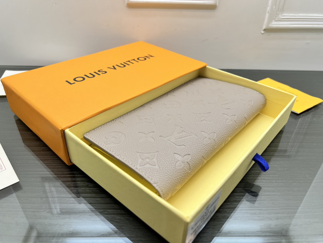 Open view of a leather bifold wallet showing card slots