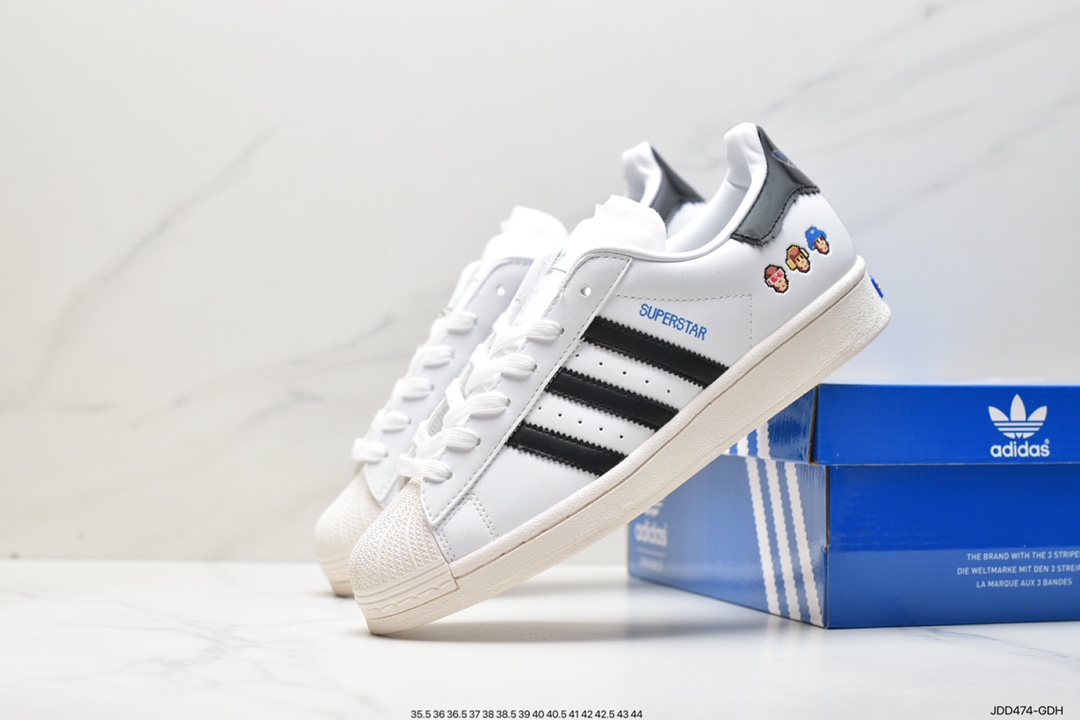 Monkey Kingdom x Adidas Originals Superstar ”Heart” classic shell toe series low-top sneakers ”leather white and black pixel style monkey” IG3500