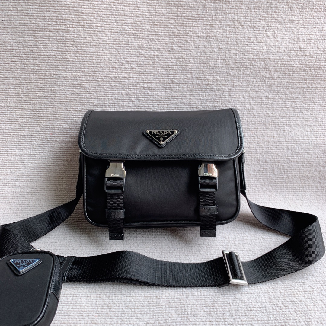 Original nylon messenger bag from Prada. The flap is cleverly decorated with the Prada triangle logo. It has a metal buckle opening and closing.
