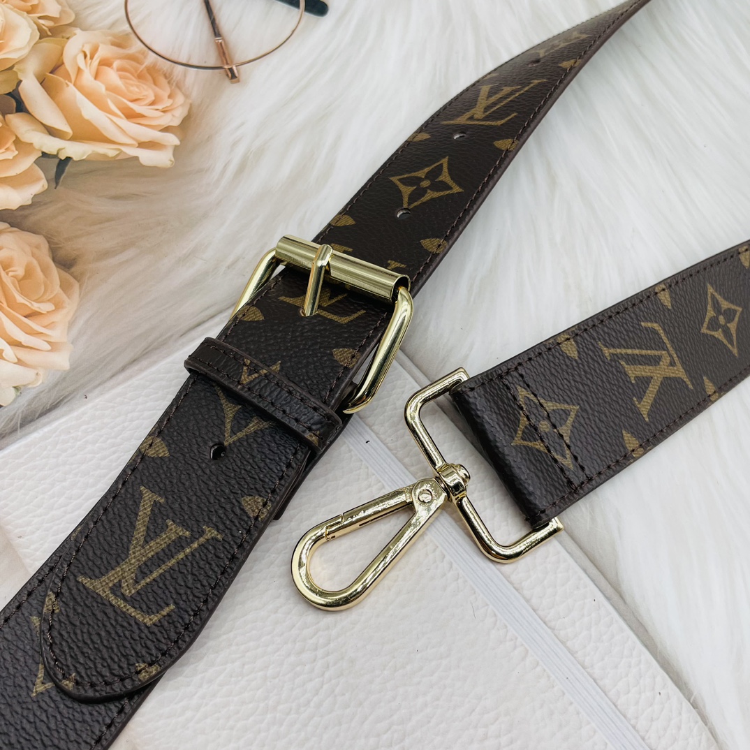 Front view of an adjustable leather shoulder strap with lobster claw clasps