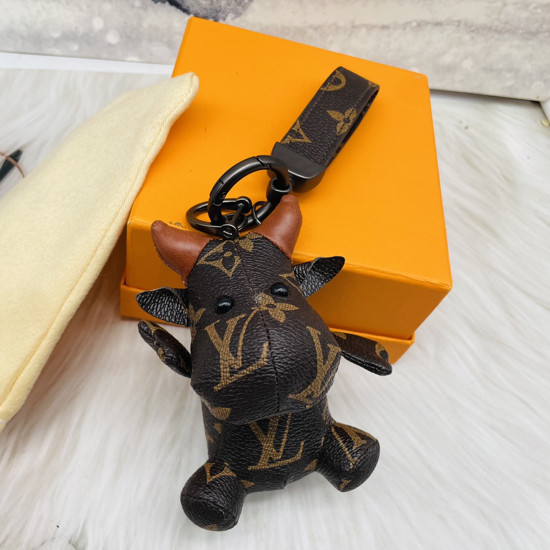 Leather bulldog handbag carried by model.