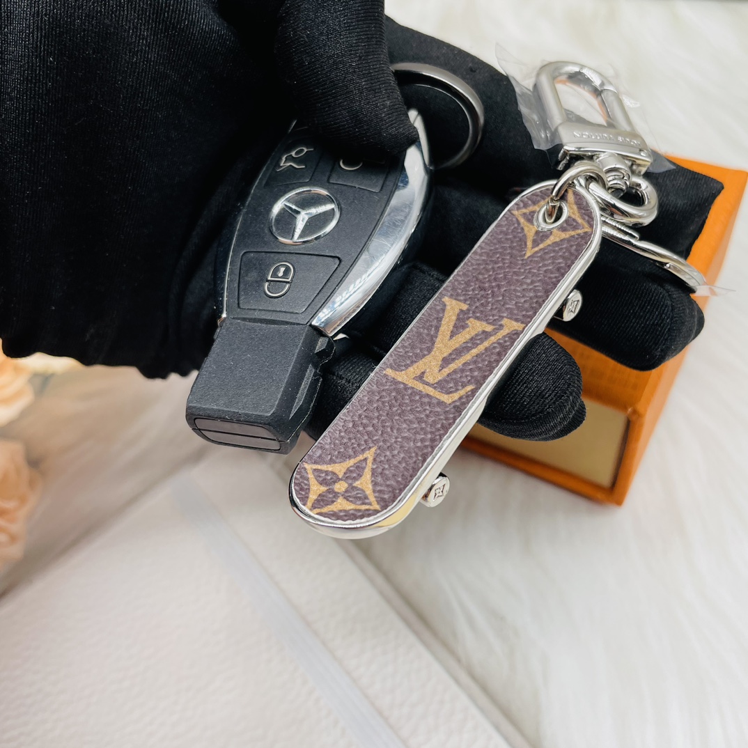 Skateboard keychain in a hand