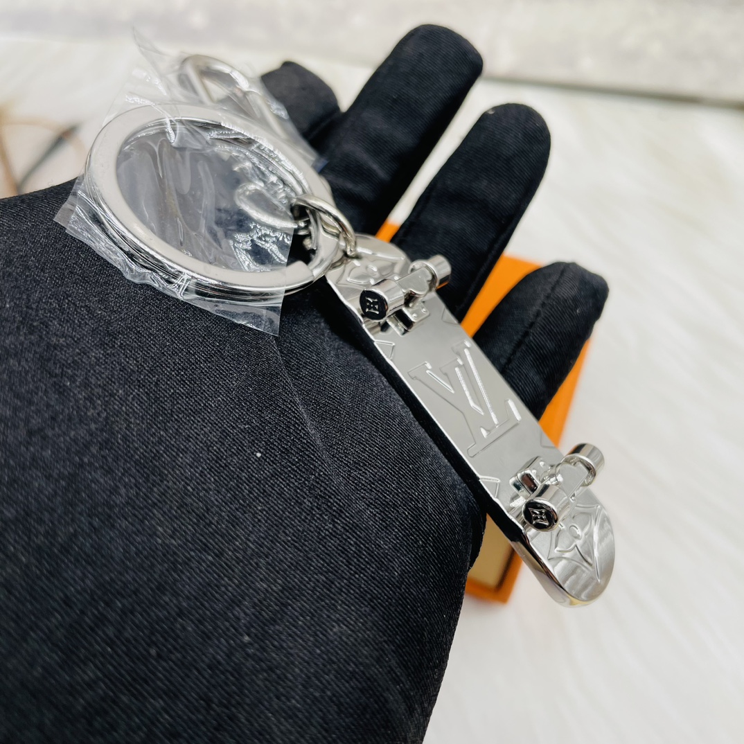 Skateboard keychain attached to a keyring
