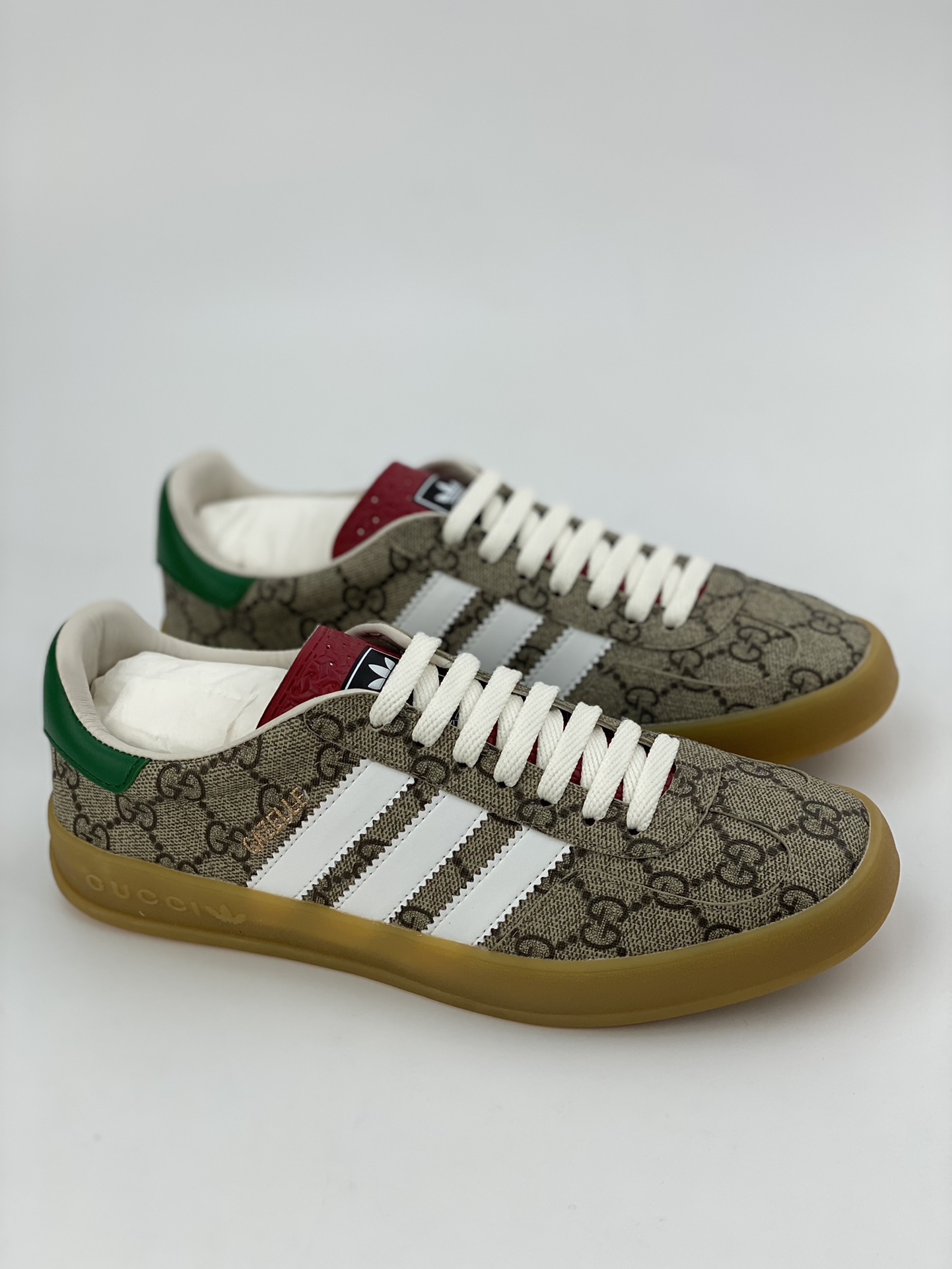 Adidas x GUCCI's blockbuster co-branded clover logo and iconic three bars are design elements