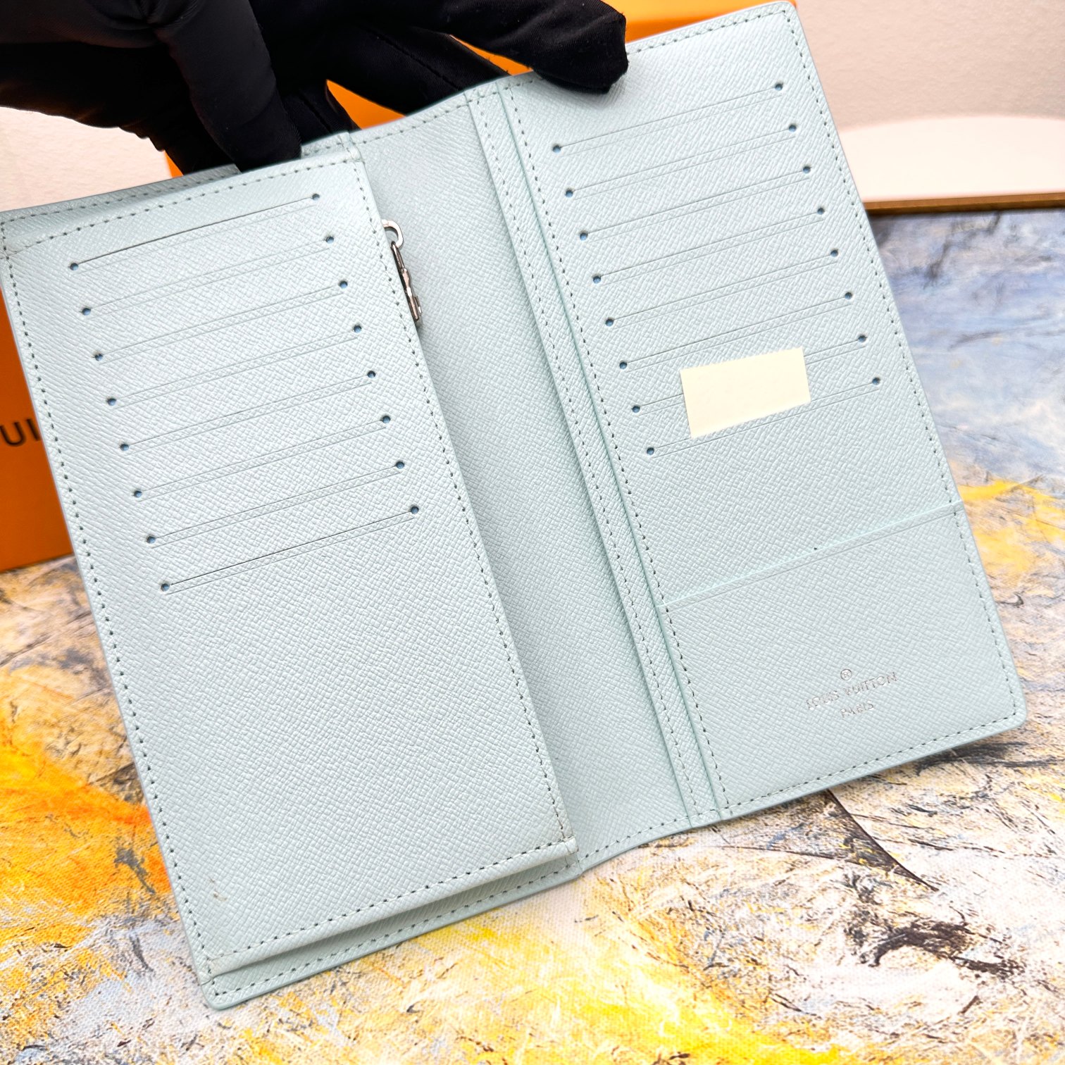 Hand holding the bifold wallet