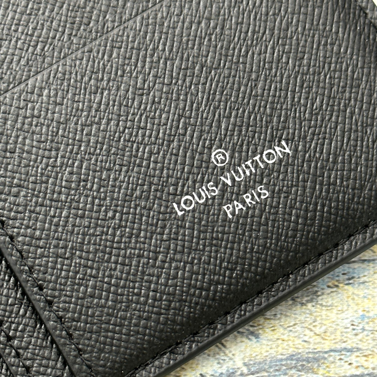 Leather bifold wallet presented in a gift box