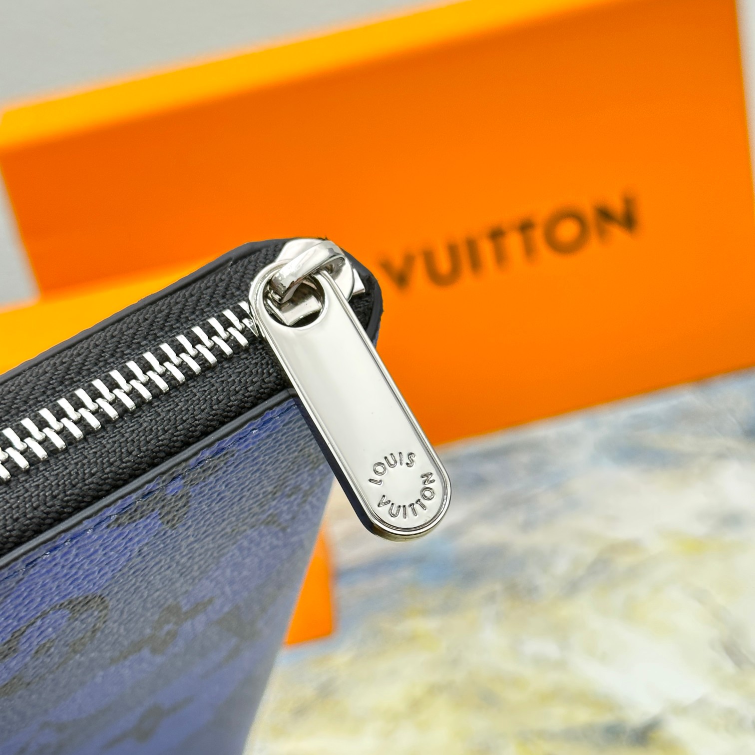 Long leather wallet held in hand