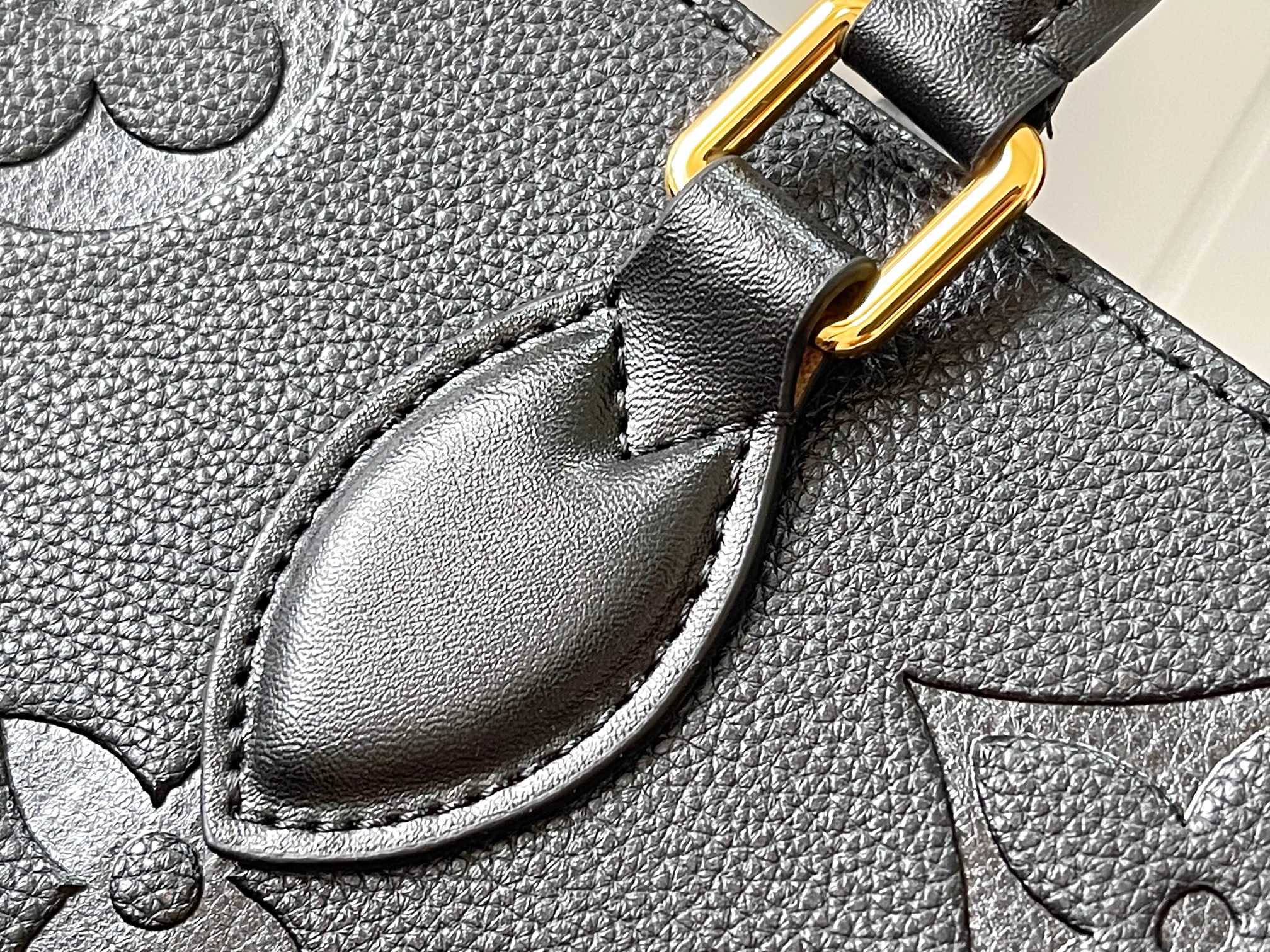 this Onthego MM handbag is crafted from Monogram Empreinte leather - Bag 6