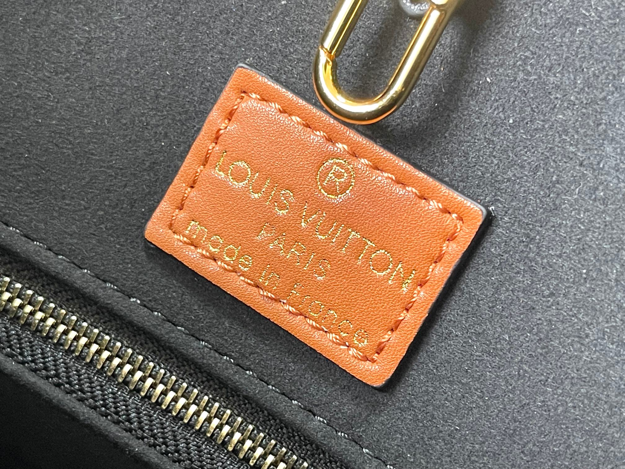 this Onthego MM handbag is crafted from Monogram Empreinte leather - Bag 9