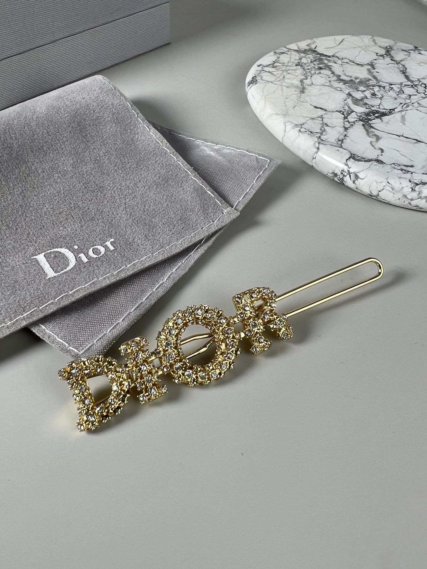 #260. Dior Drilling Logo letters hairpin, inspired by Lady Dior’s handbag. Gold-coated metal, Dior