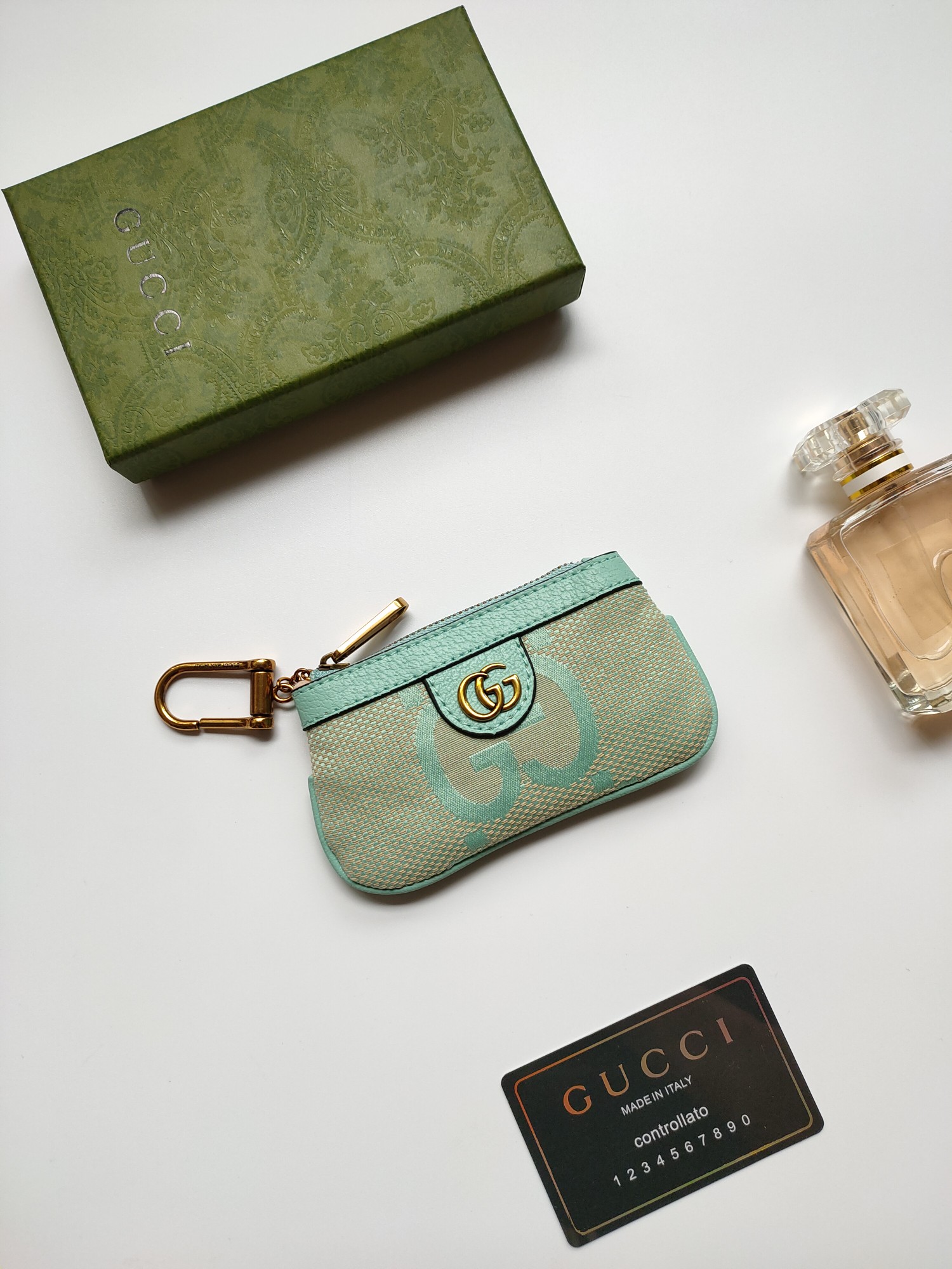 Gucci 小零钱包 - 大字布料と古銅双G金具のデザイン